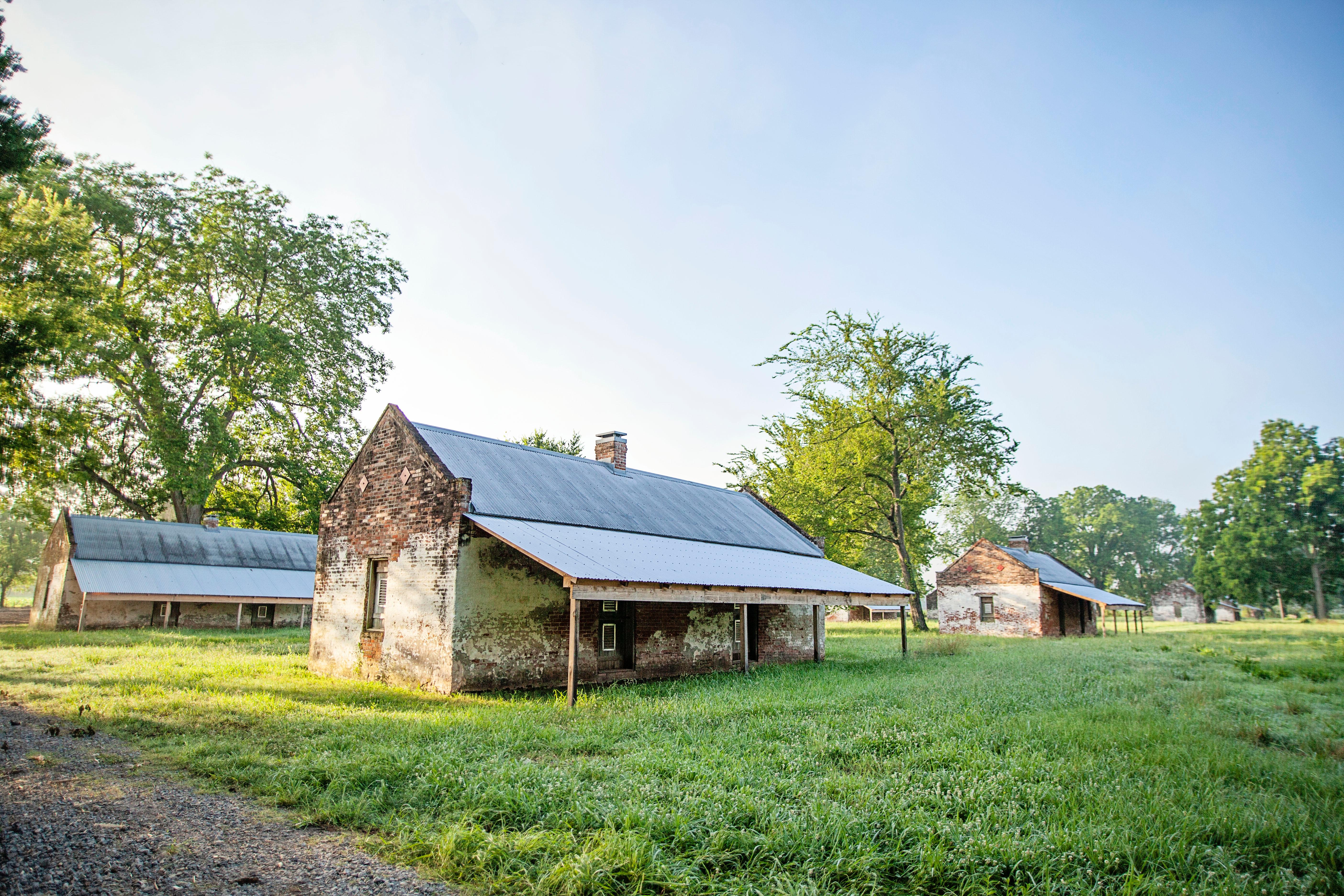 Brick cabins built to house enslaved workers, served as homes for tenant farmers into the 1960s.