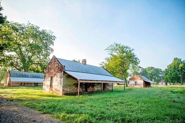 Brick cabins built to house enslaved workers, served as homes for tenant farmers into the 1960s.