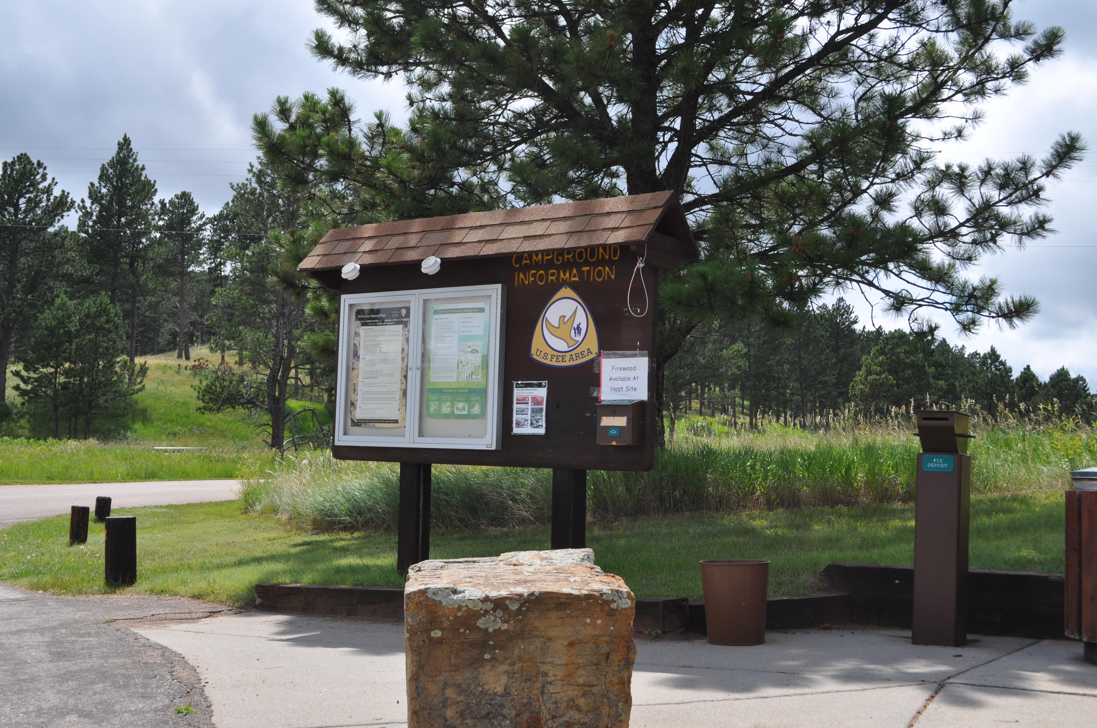 The Elk Mountain Campground reservation board with information and a drop box for cash payments.