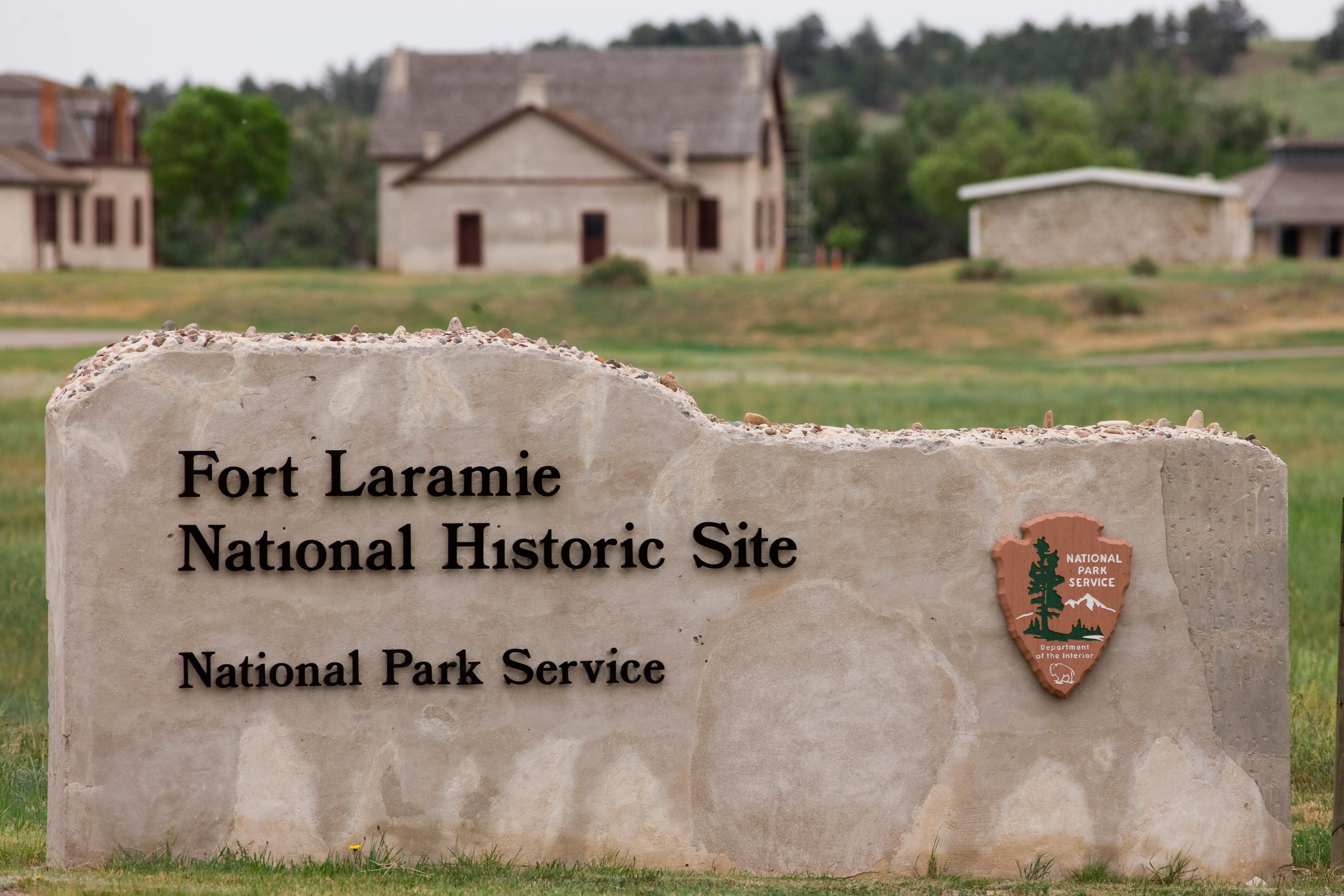 A stone sign with black lettering that spells Fort Laramie National Historic Site