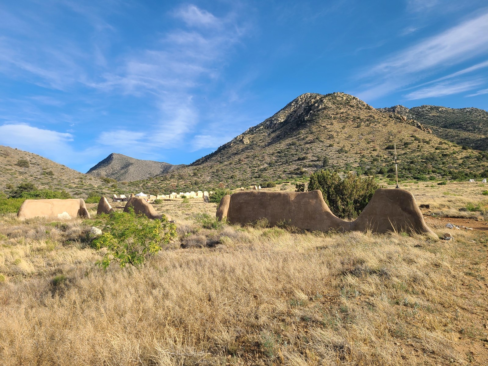 Ruins of the fort with mountains and valley in the background.