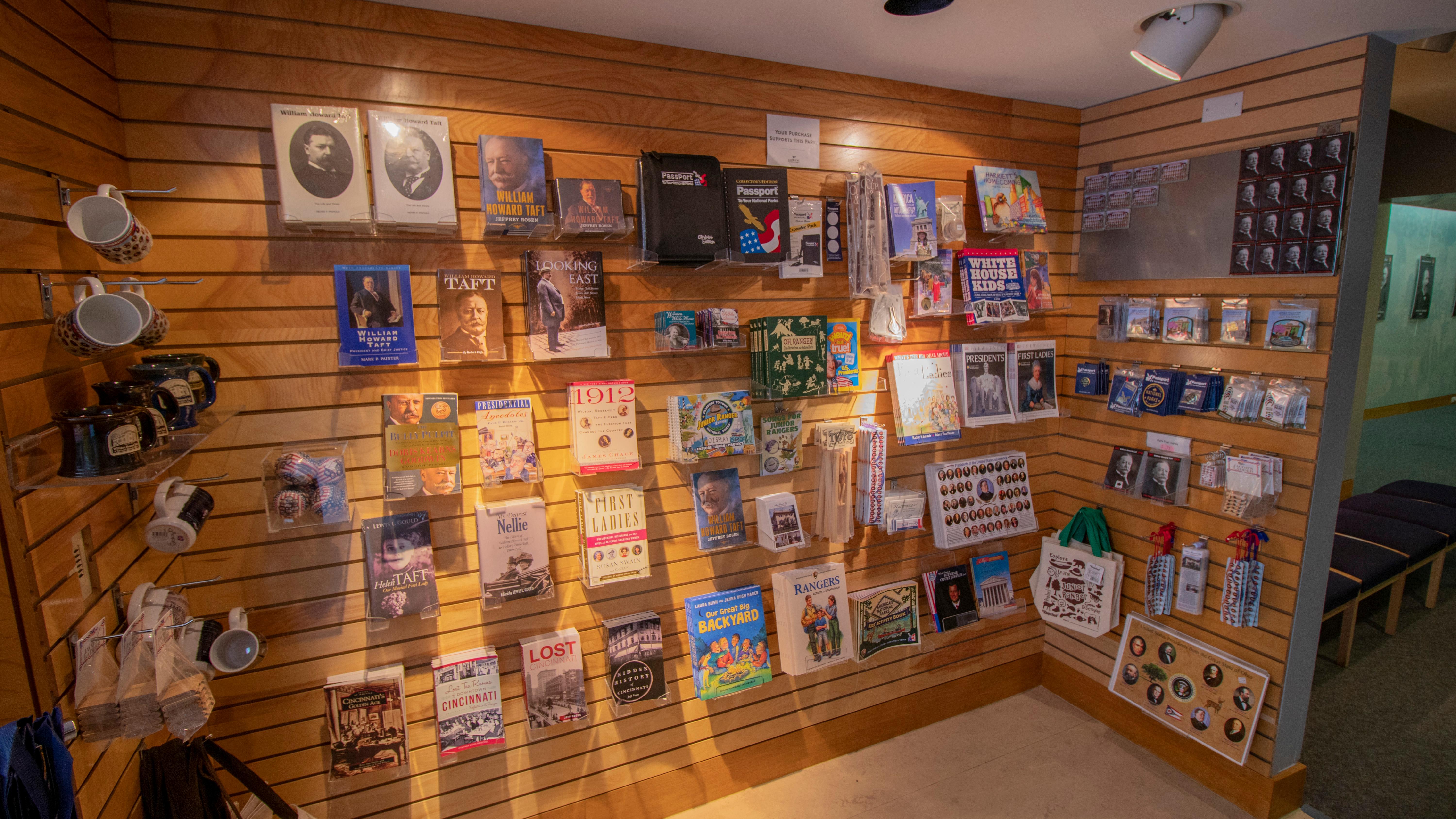 Several books and gift items arranged in rows on slotted walls