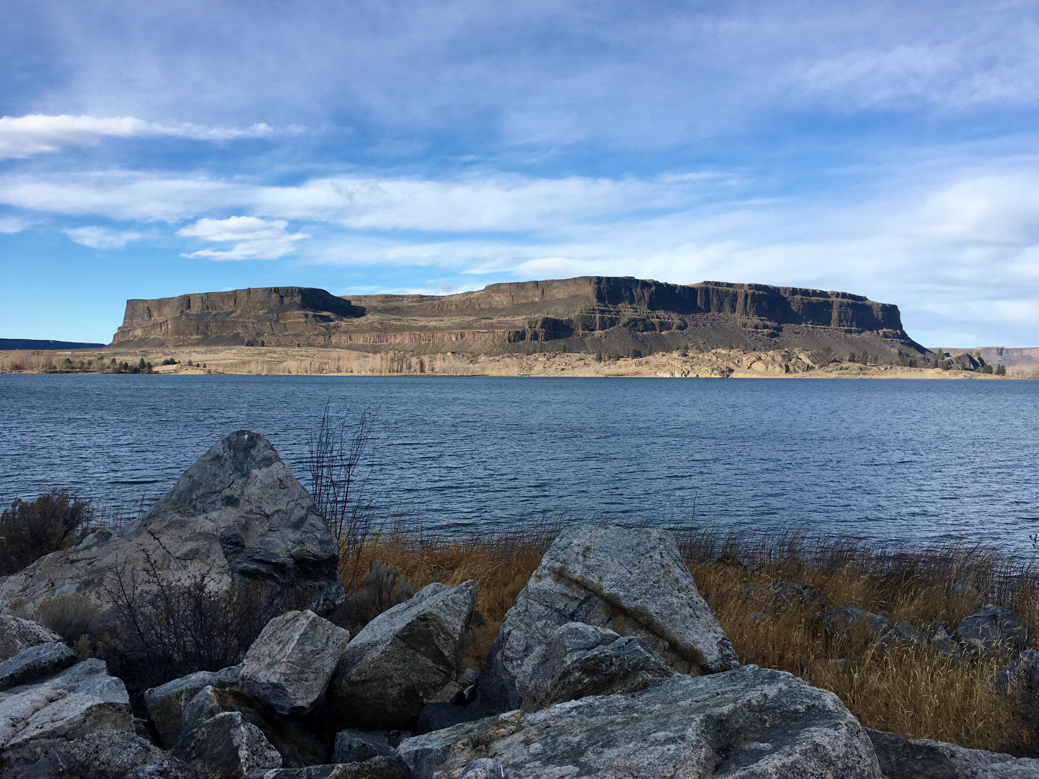 Large butte with lake in the foreground