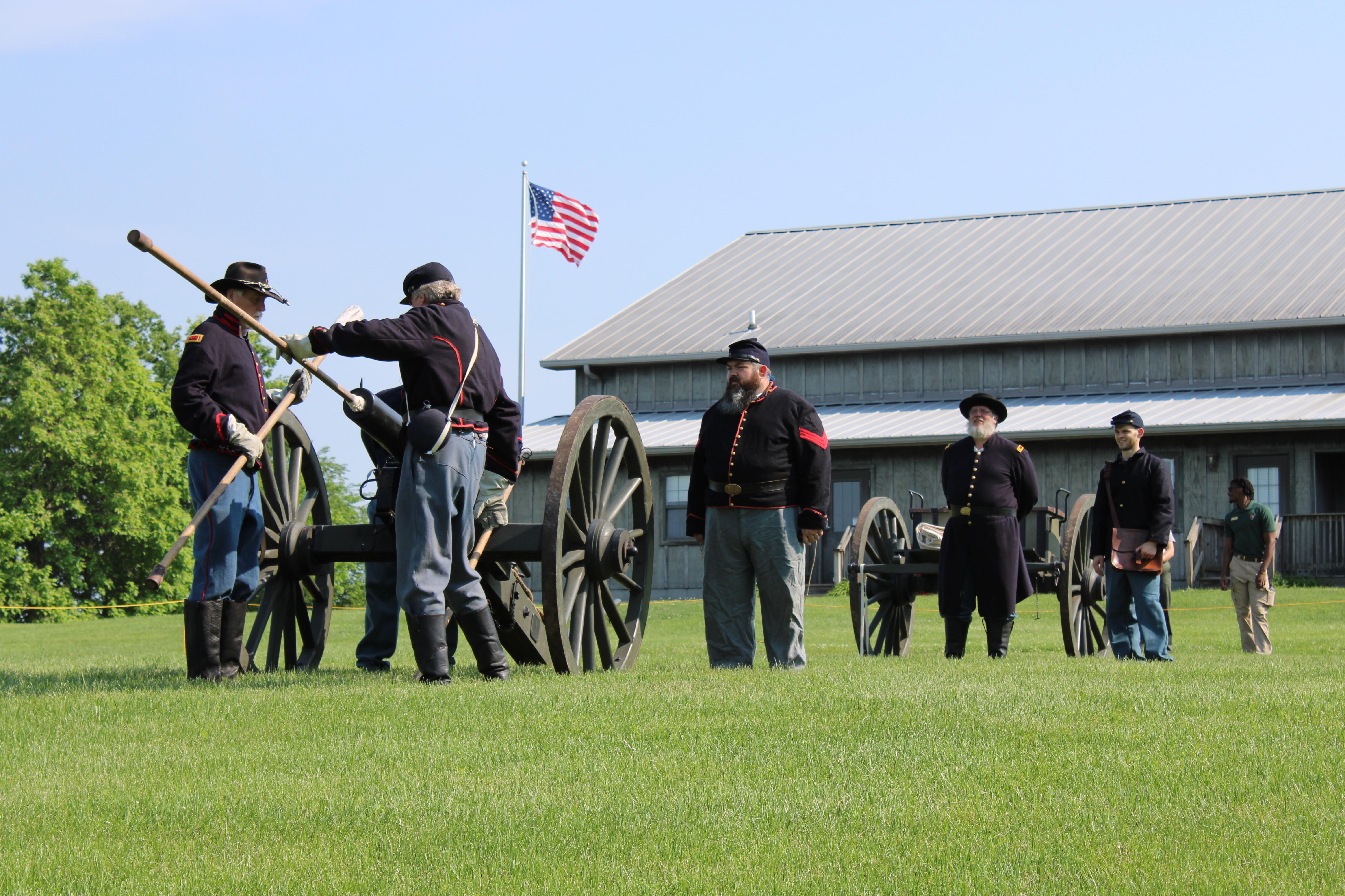 Living Historians portraying US Army artillery practice loading a cannon