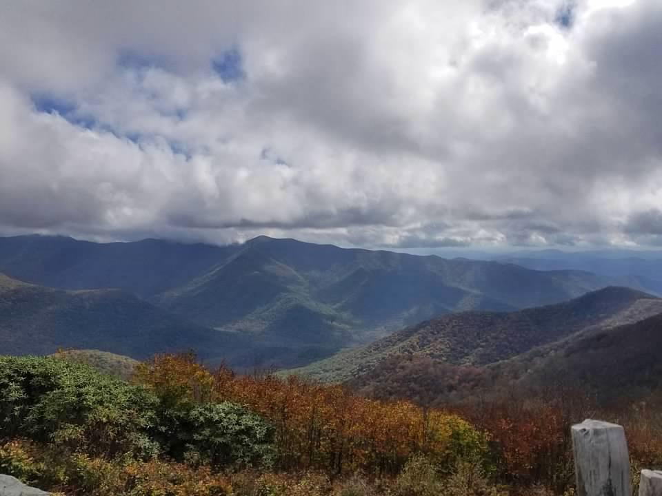 Forest clad mountains under a cloudy sky