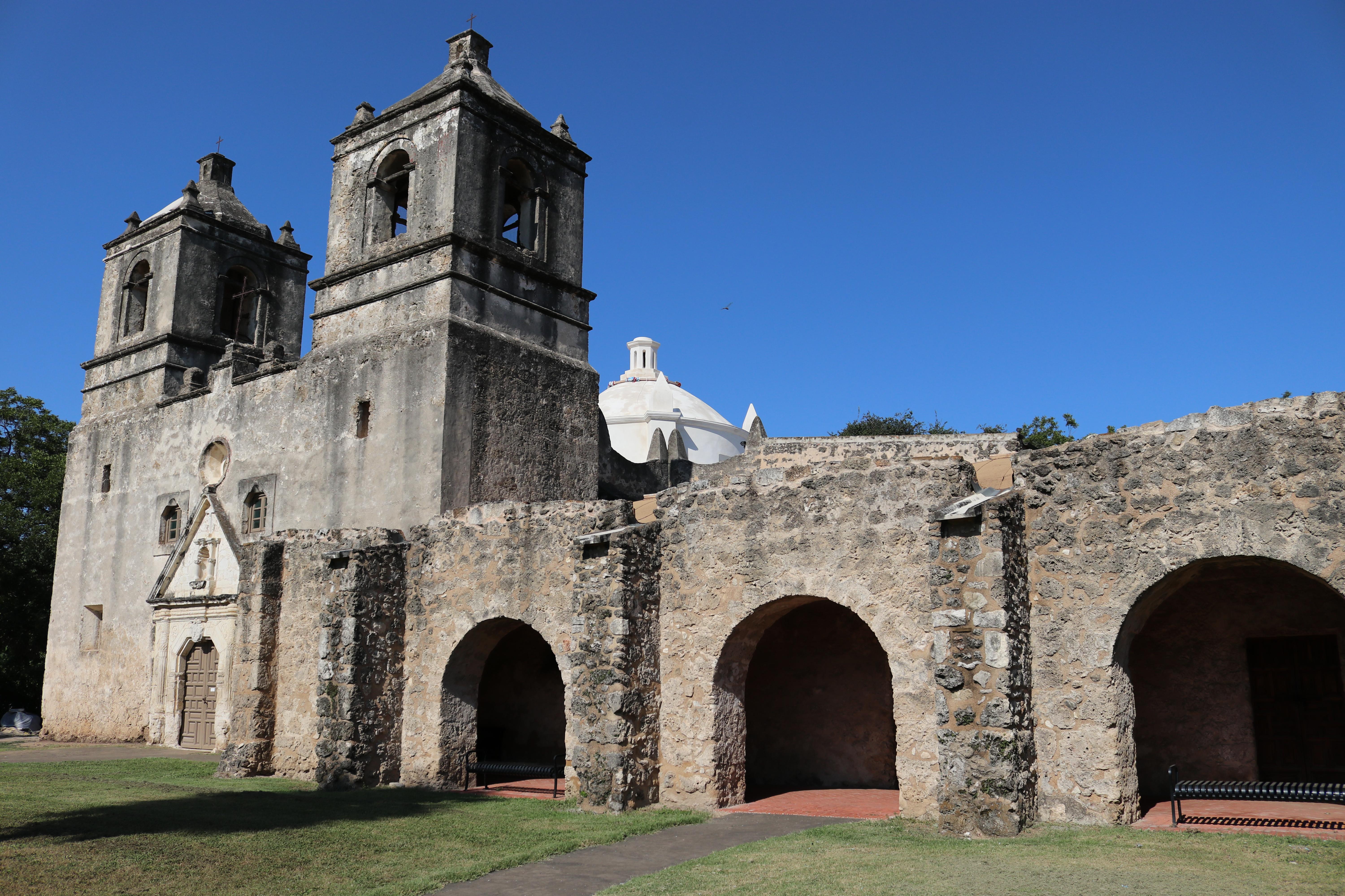 Mission Concepcion convento with church in background.