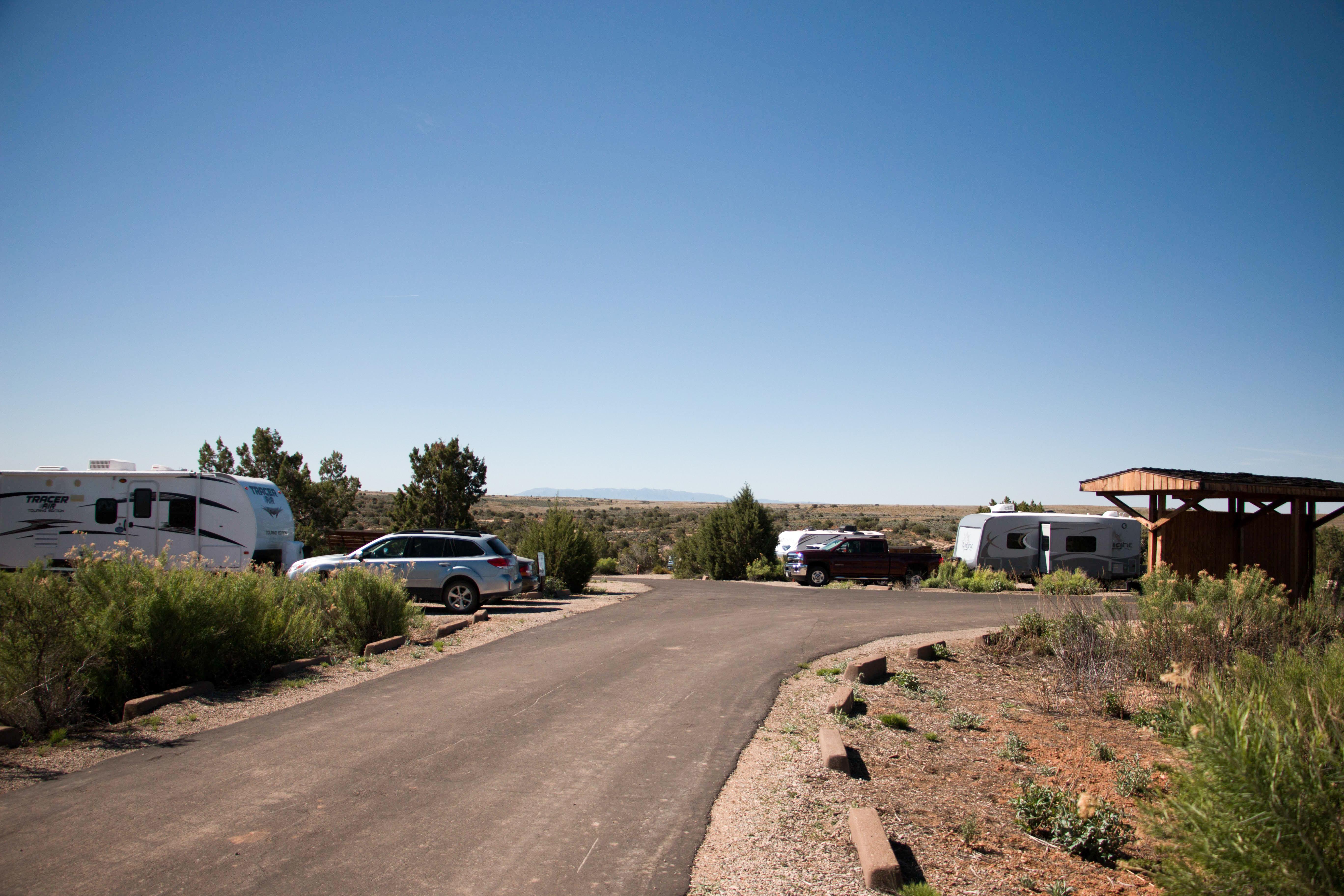 RVs and trucks parked at campsites