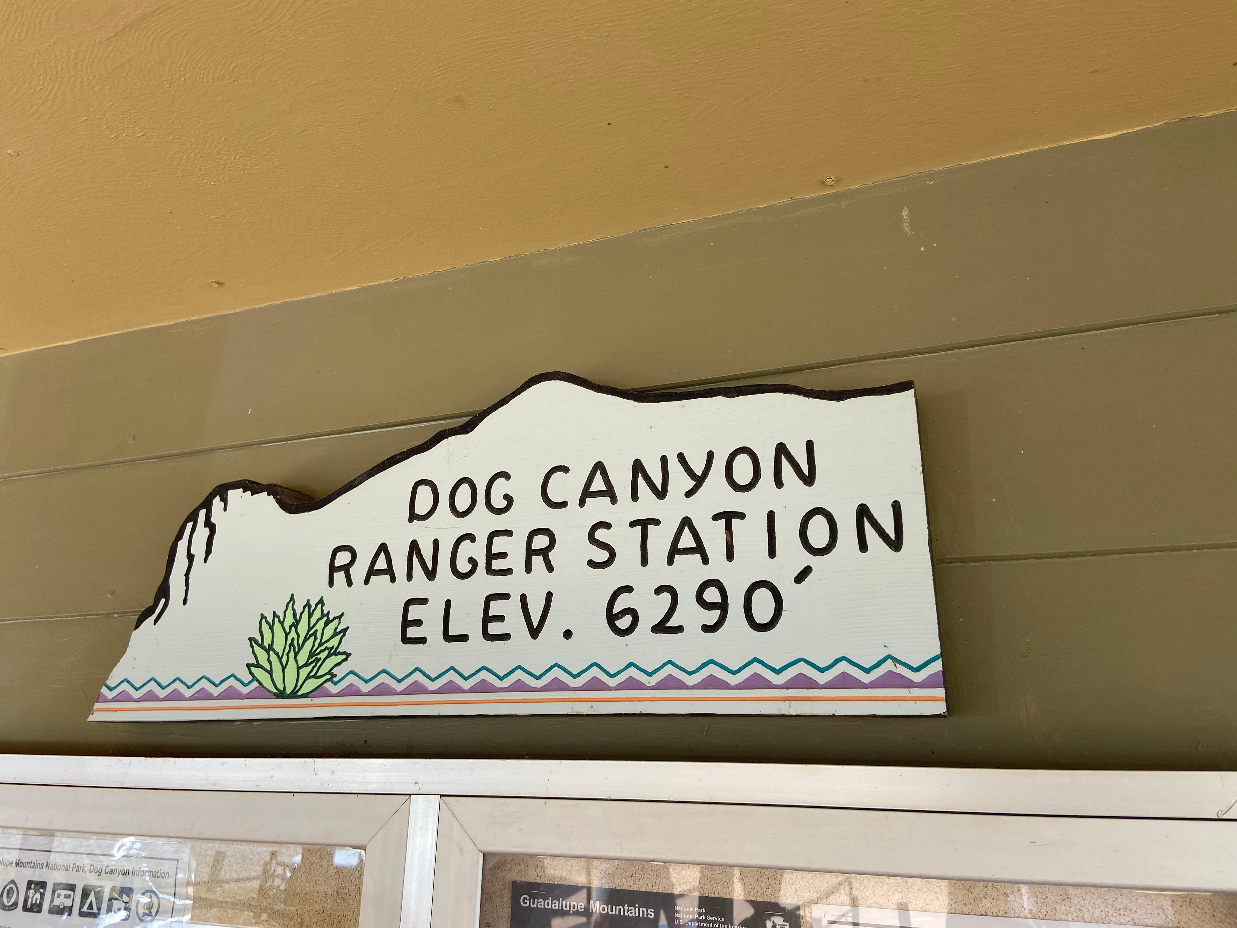 A stylized sign in the profile of El Capitan reads "Dog Canyon Ranger Station"