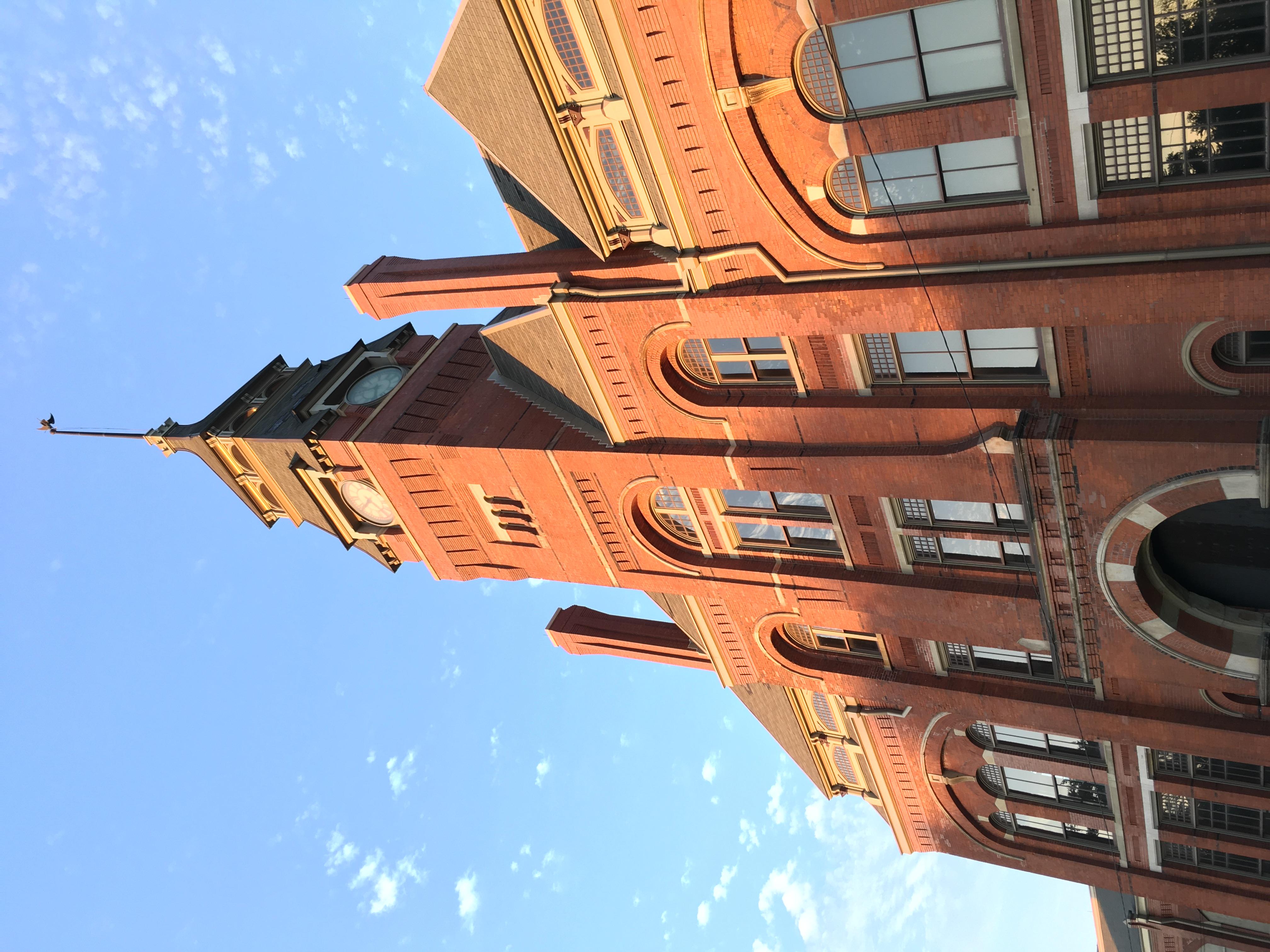 front of clocktower taken looking up  with blue sky, sunny