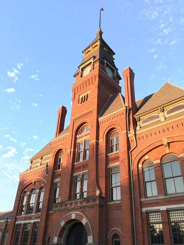 front of clocktower taken looking up  with blue sky, sunny 