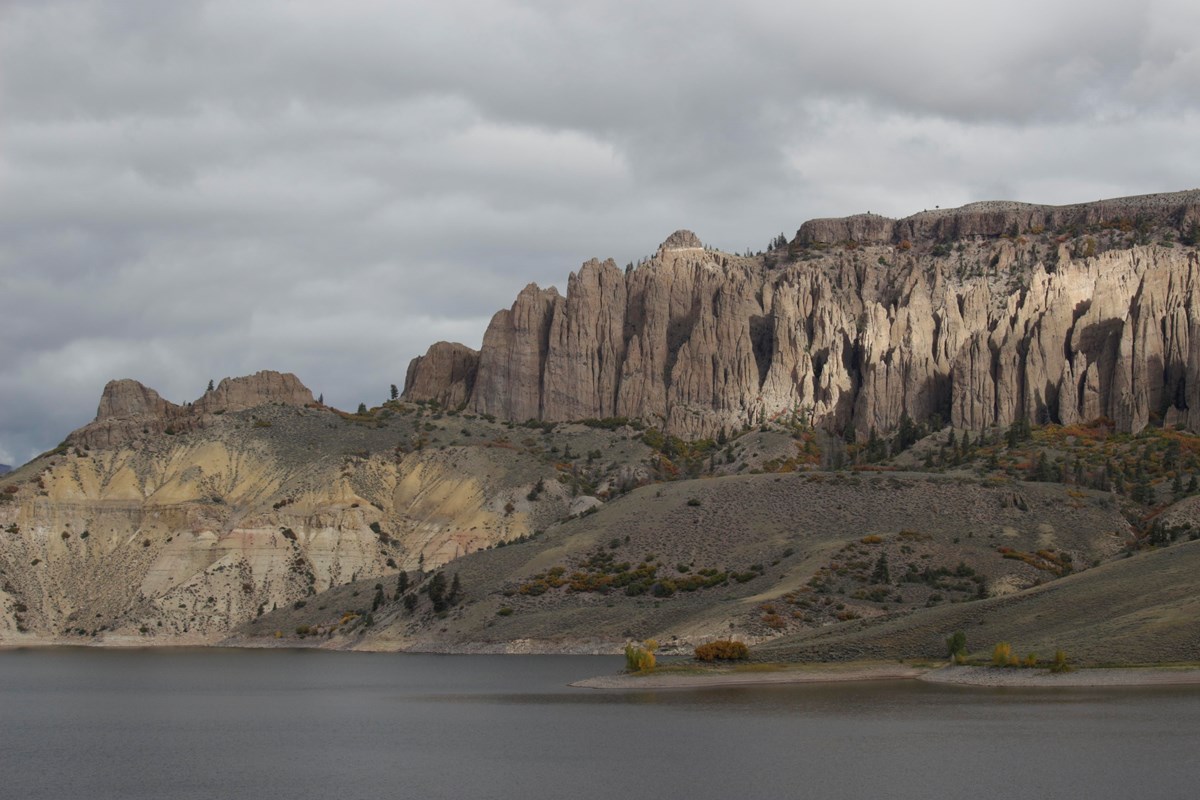 Large pinnacle spires across a body of water