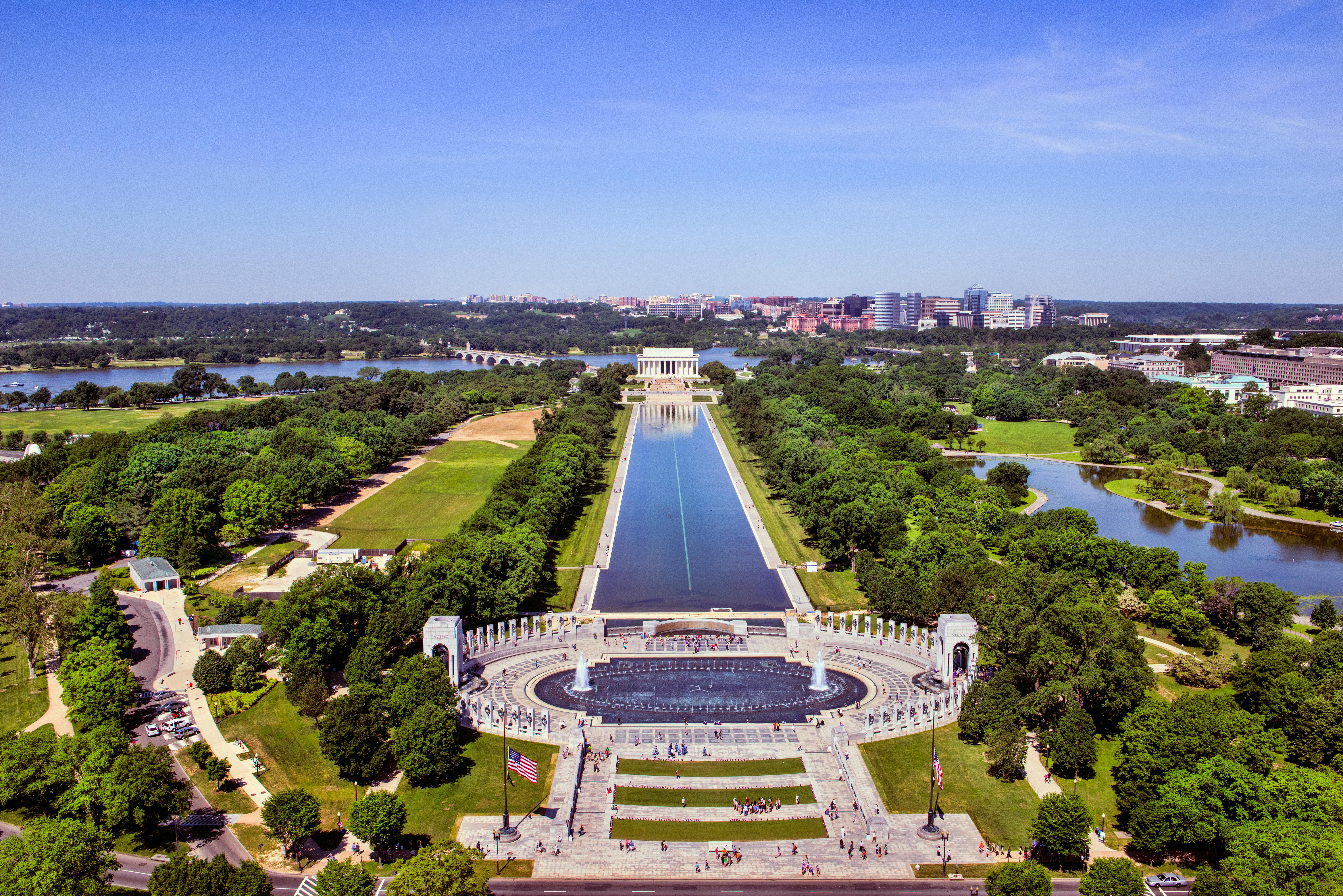 Aerial view of stone columns around an oval-shaped pool at the World War II Memorial.