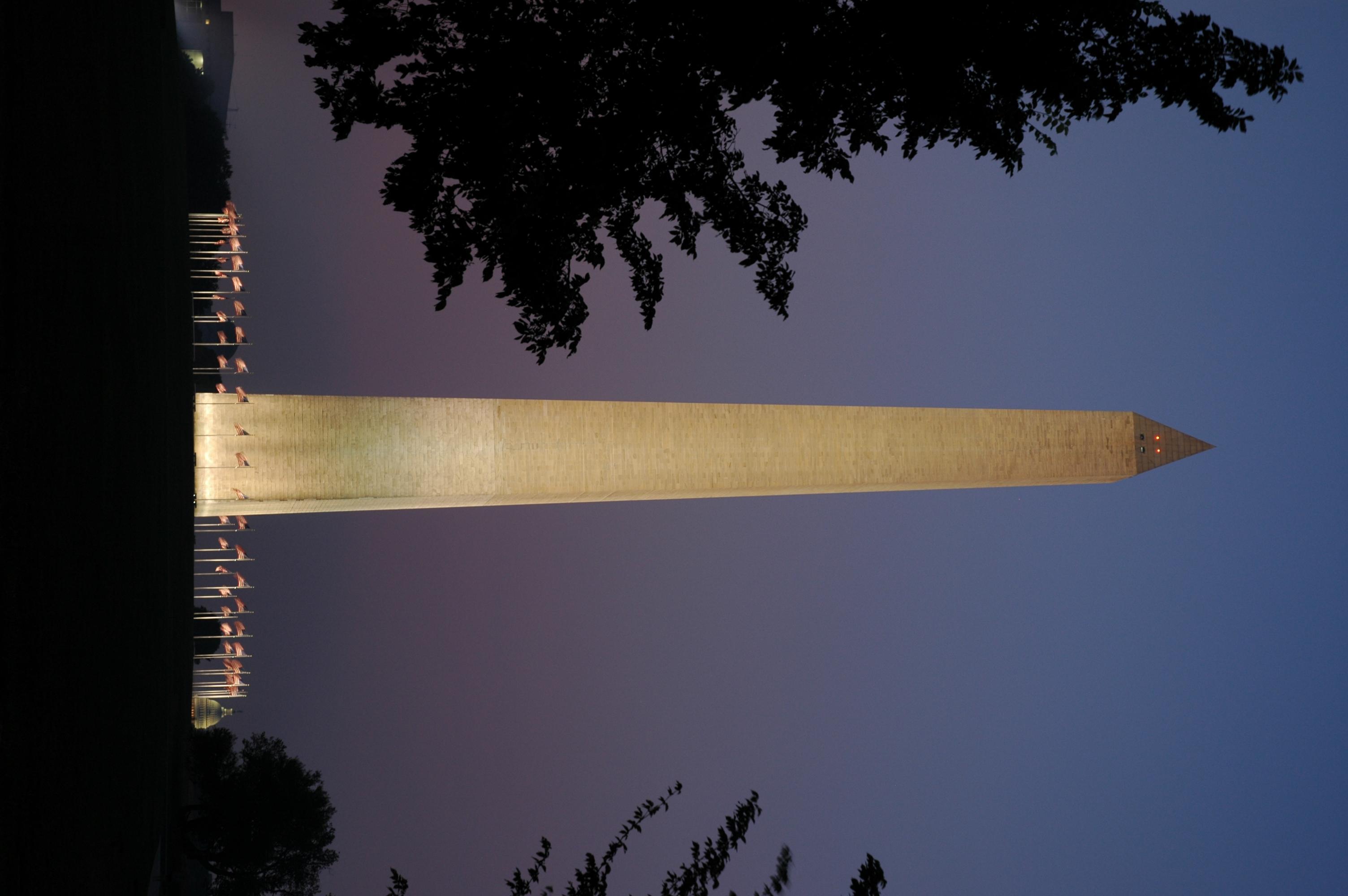 Washington Monument lit at night.