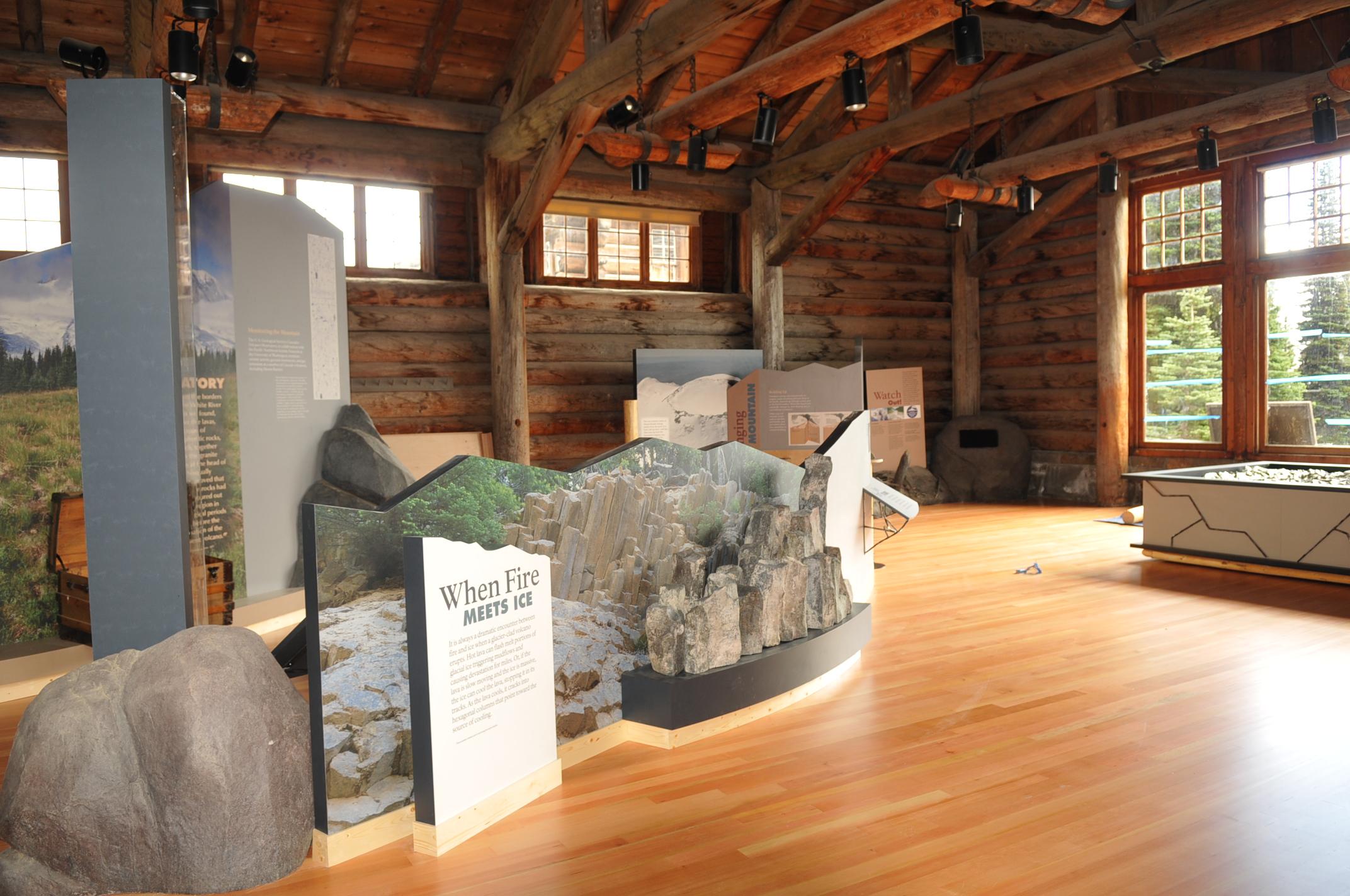 Natural and fabricated exhibit elements inside the rustic Sunrise Visitor Center.
