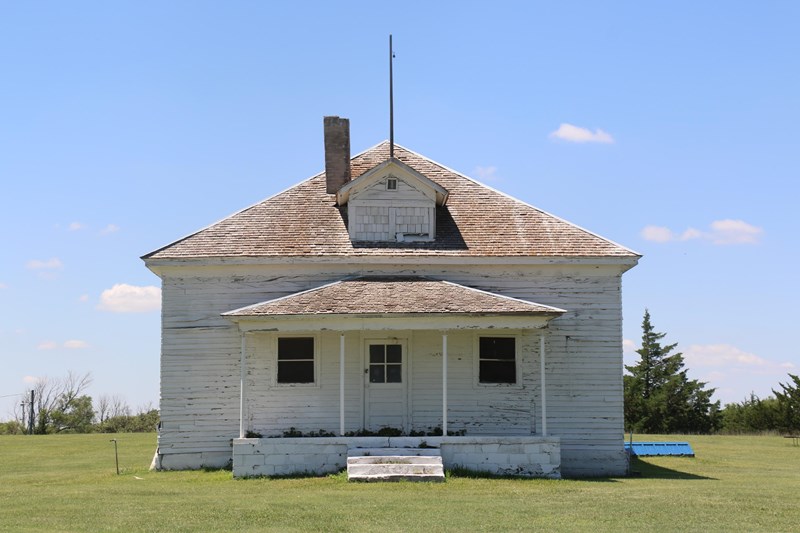 School District Number 1 A wooden building painted white