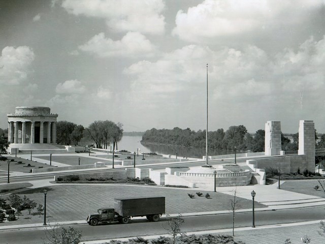 The Clark memorial and bridge approach with agriculture truck in foreground.