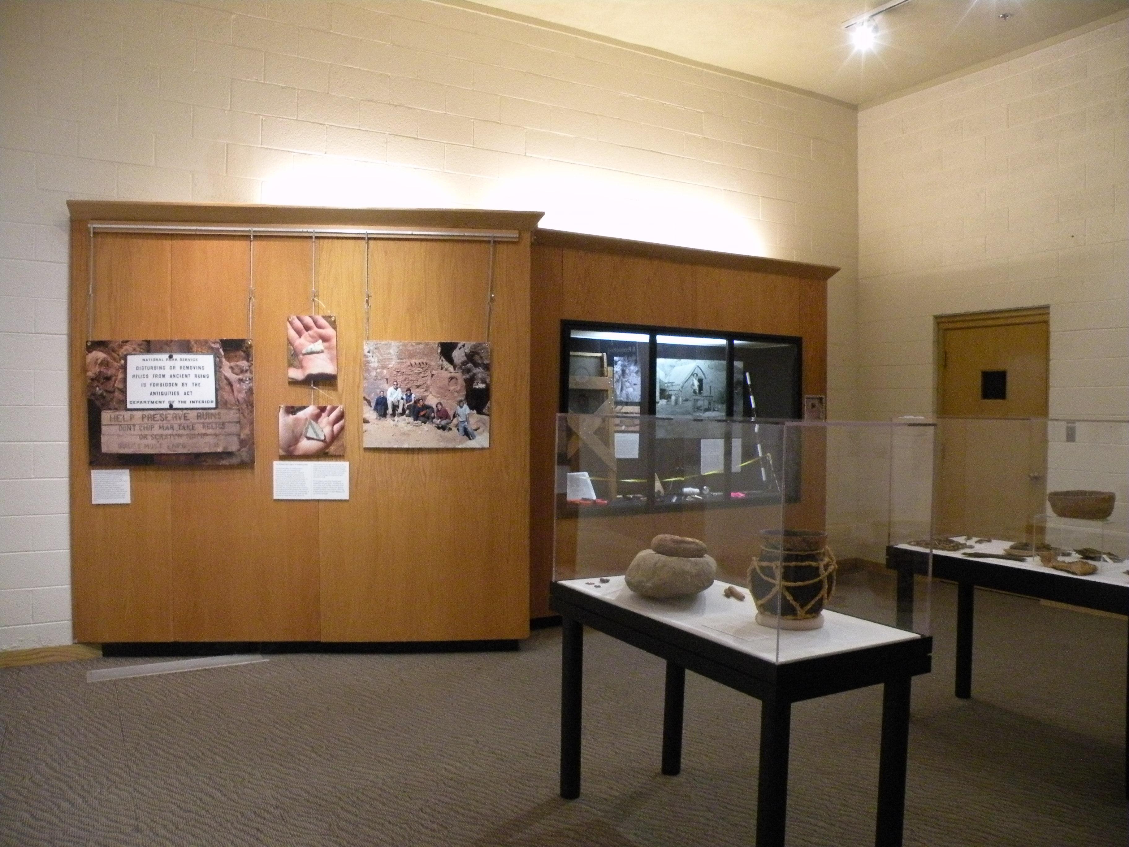 Interior of a museum with glass cases containing artifacts