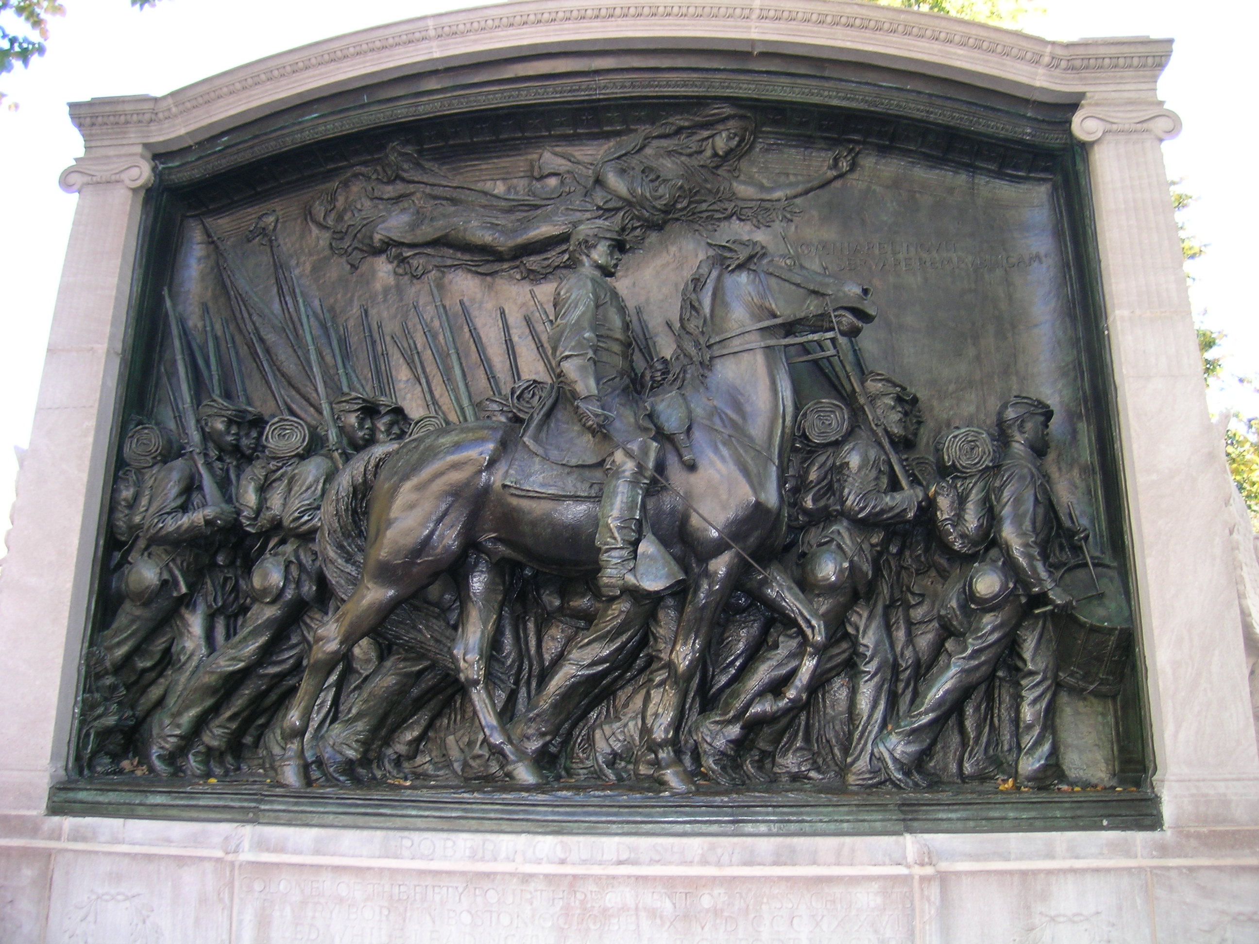 A large bronze statue showing a man on horseback and soldiers walking alongside him