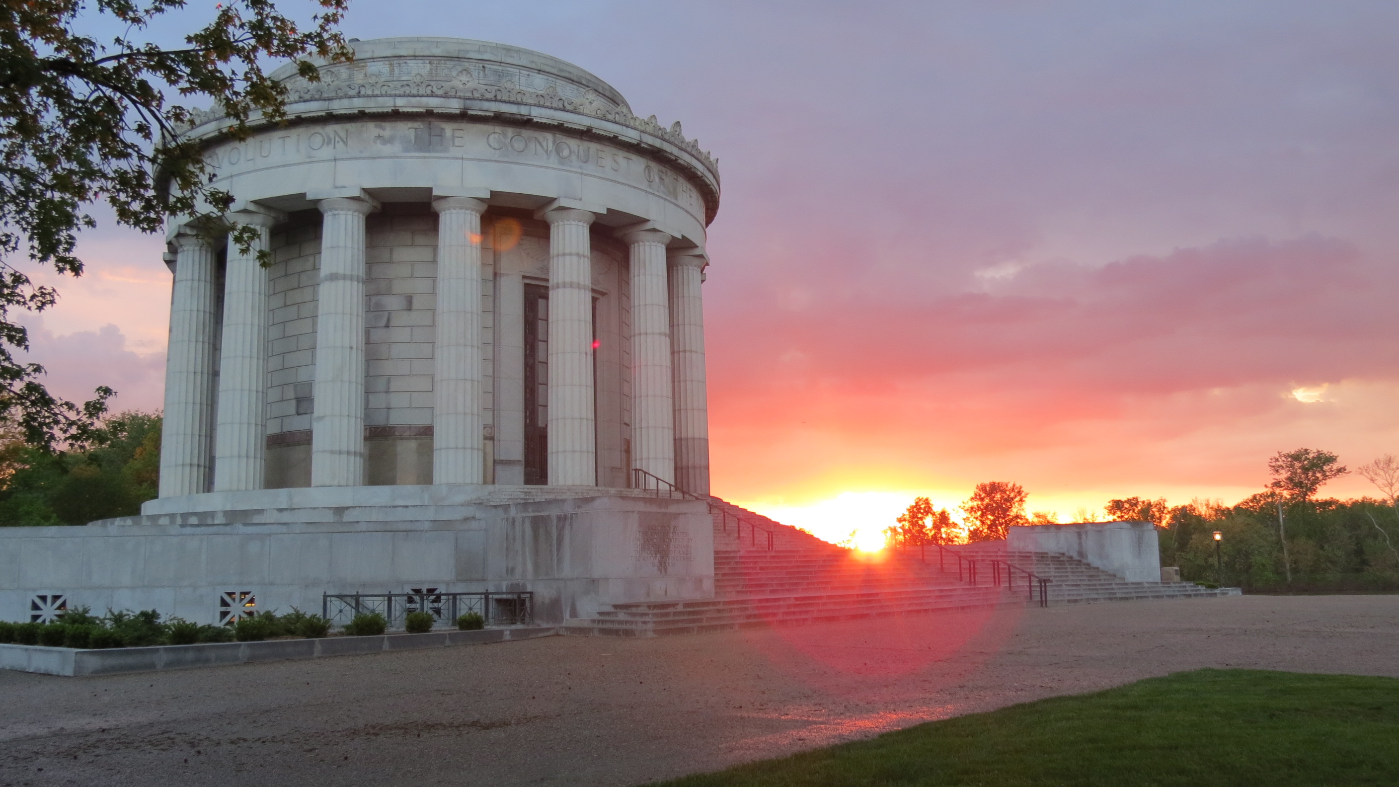 Sun setting behind the Clark Memorial