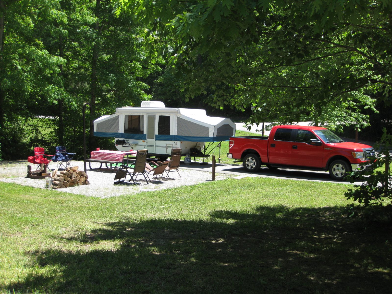 pop up camper and truck on a campsite