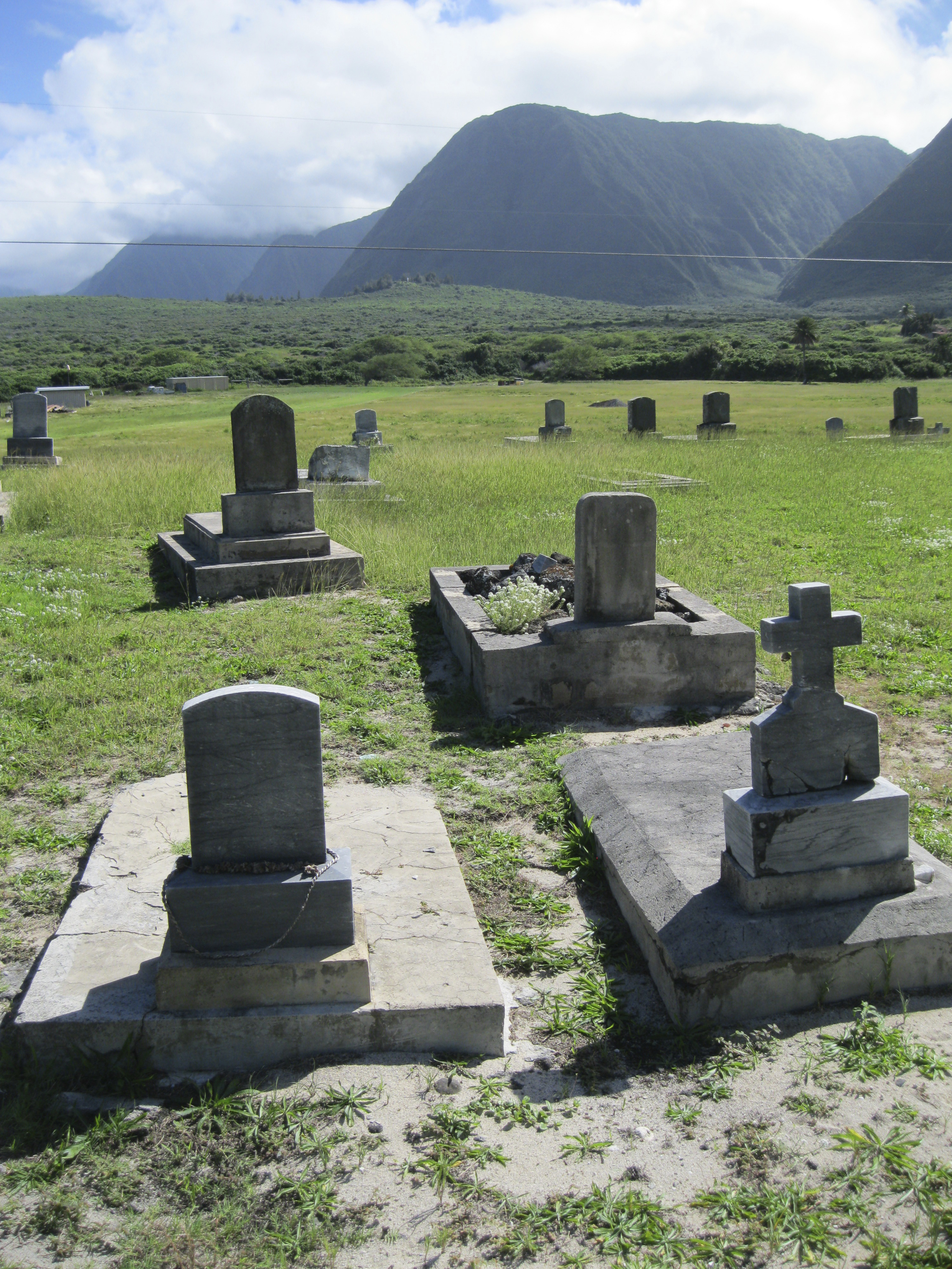 View of grave markers at Papaloa Cemetery in Kalaupapa