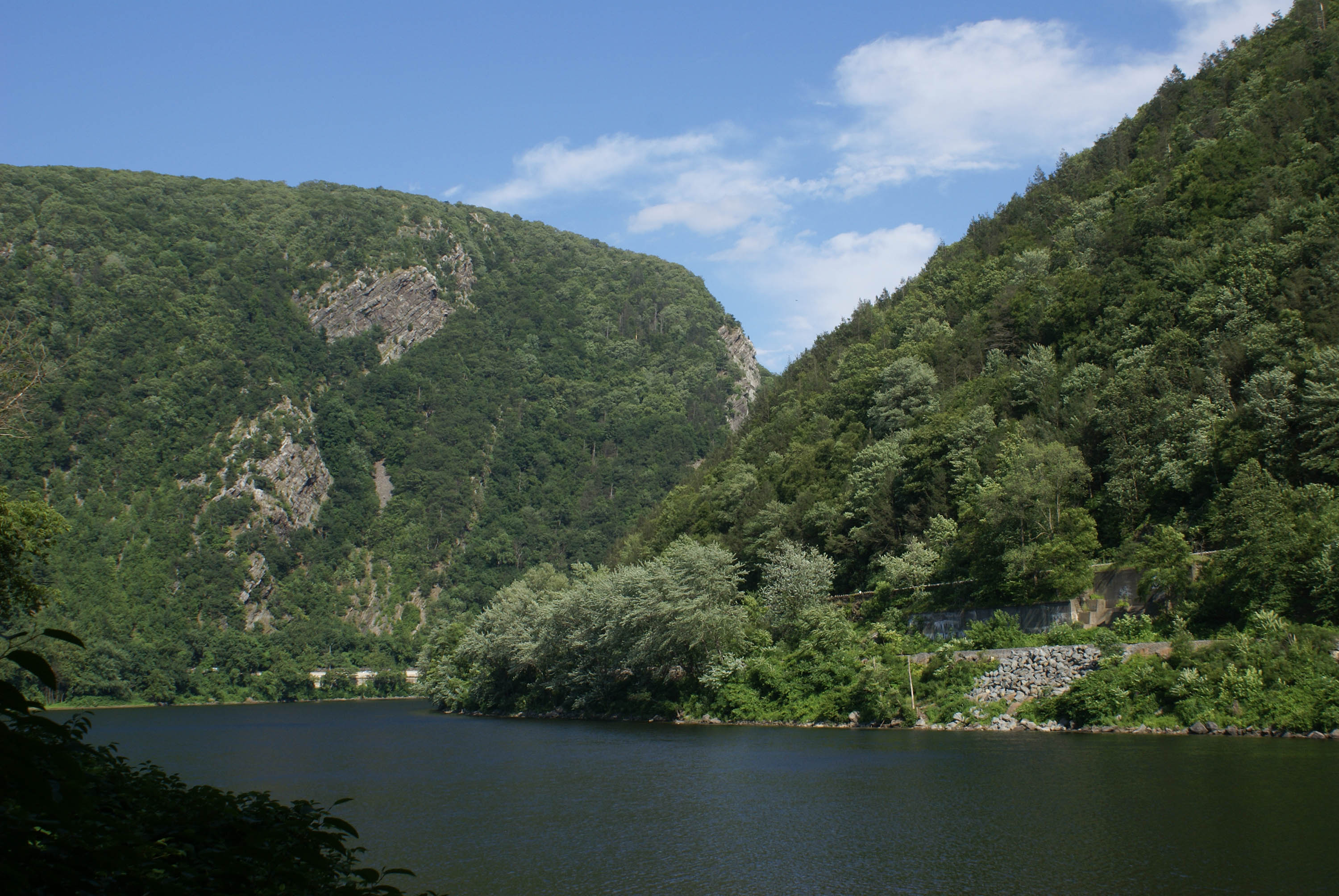 View of the Delaware River cutting between two low mountain peaks