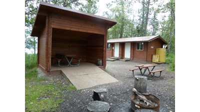 Adirondack style shelter and fire grate
