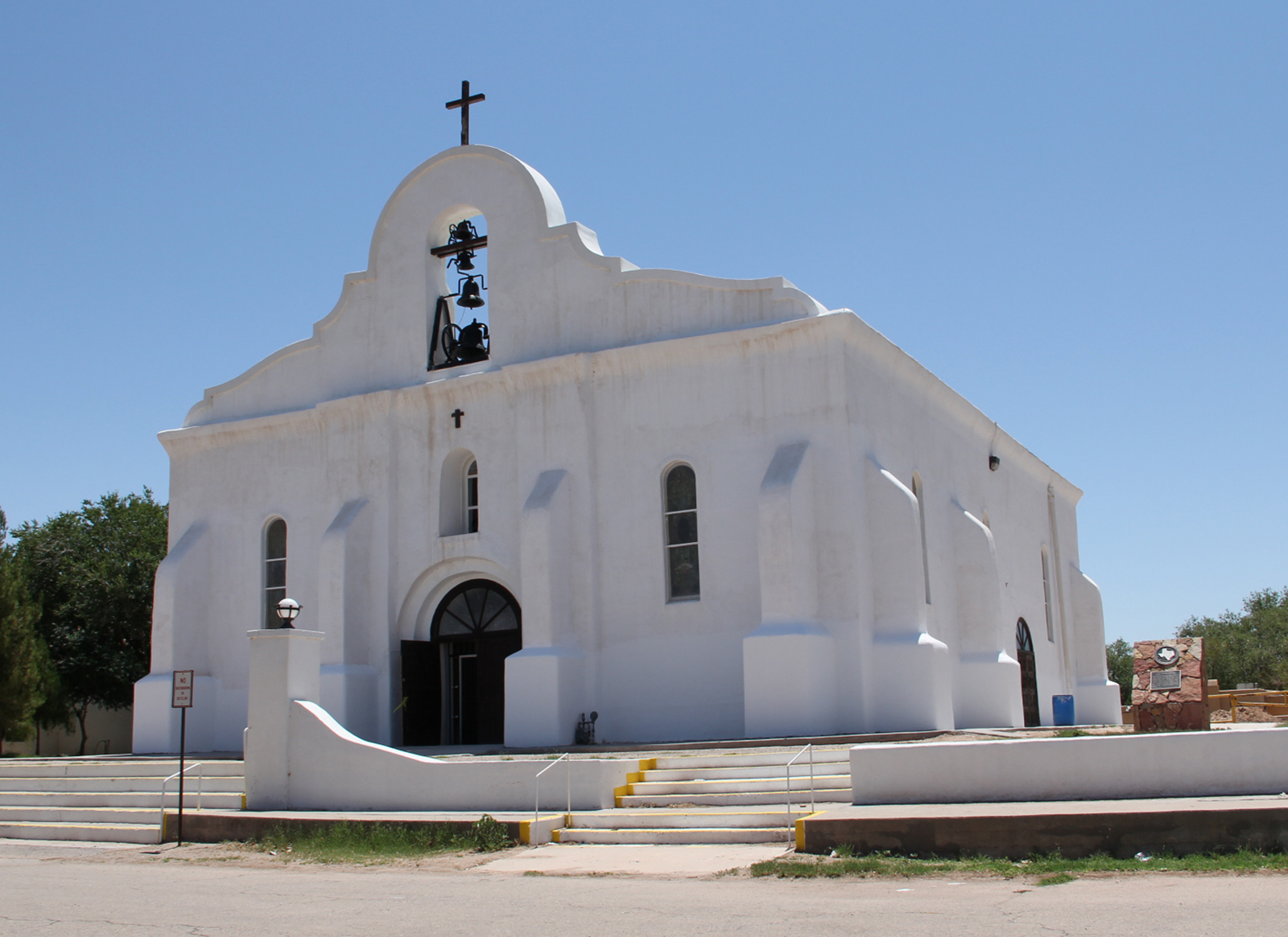 large white chapel under blue sky