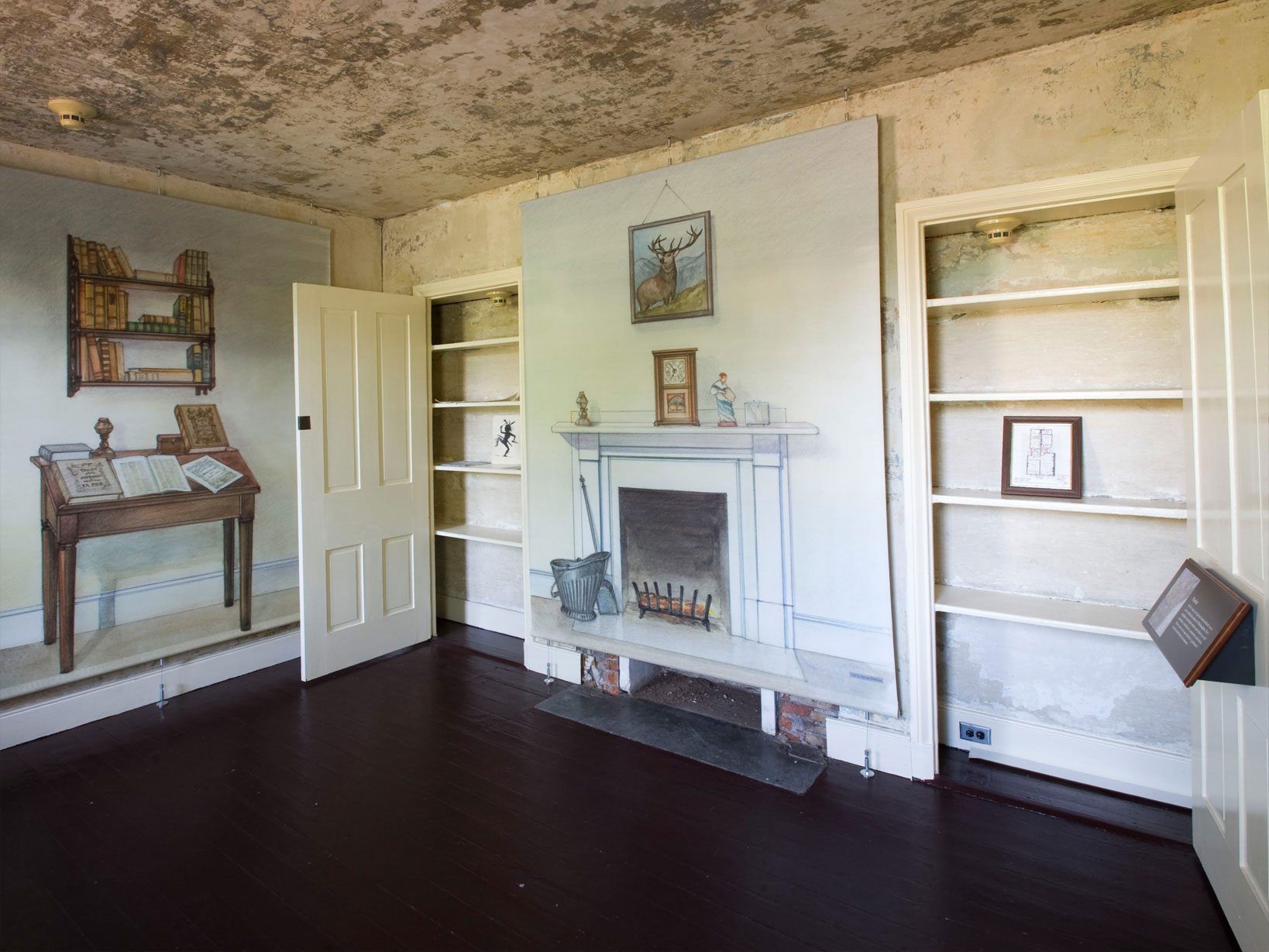 Color photo of the parlor in the Poe House showing illustrations of furniture on the walls.