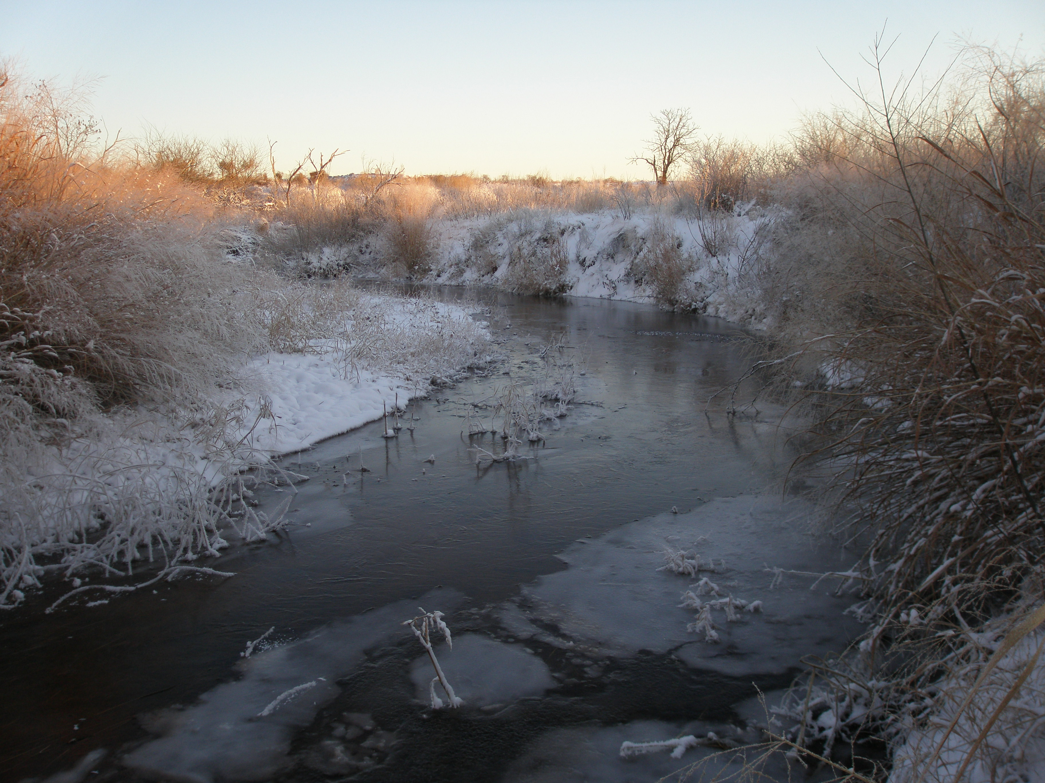 The Washita River in winter covered in ice and snow