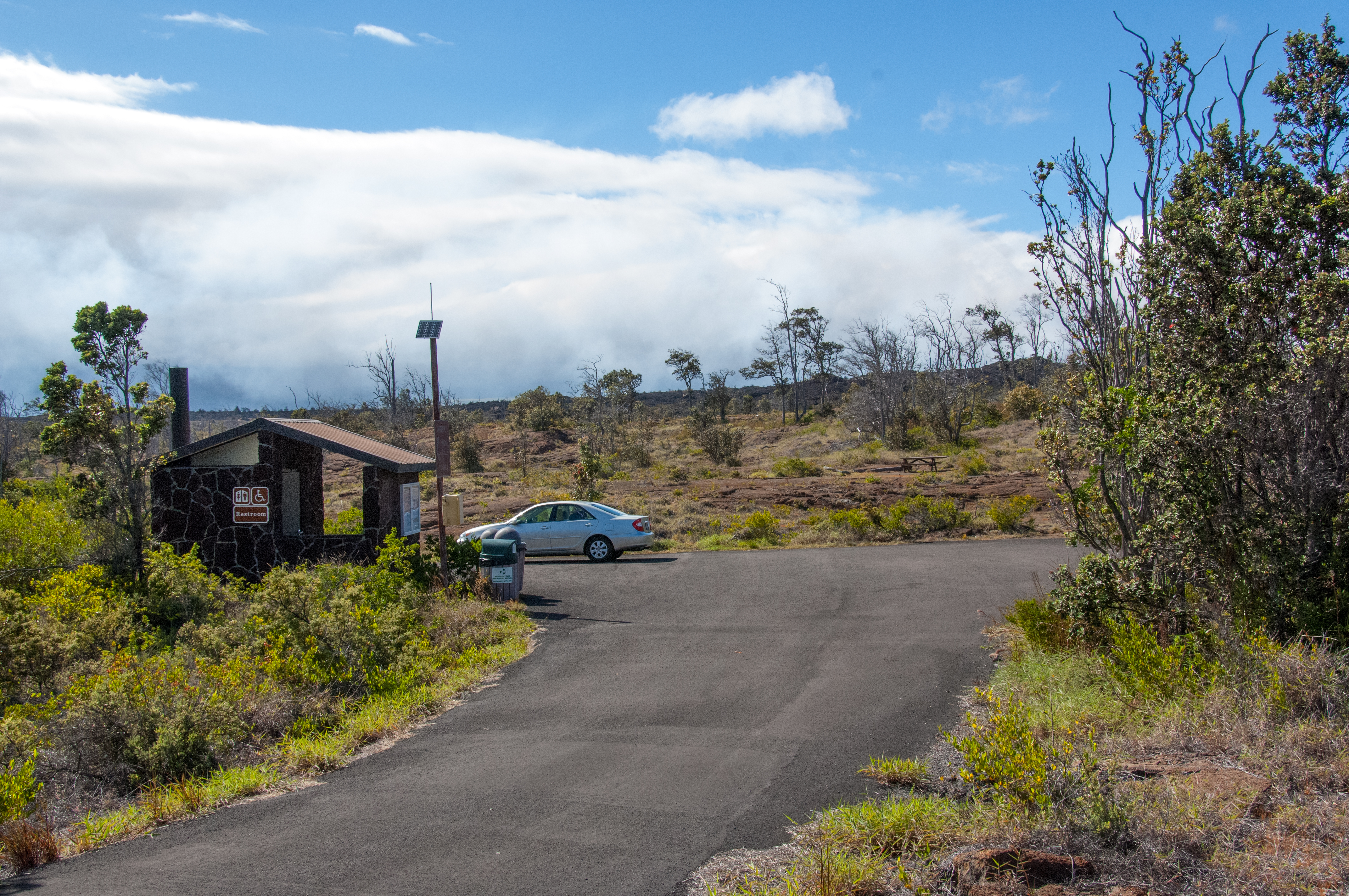 View of campground and accessible vault toilet