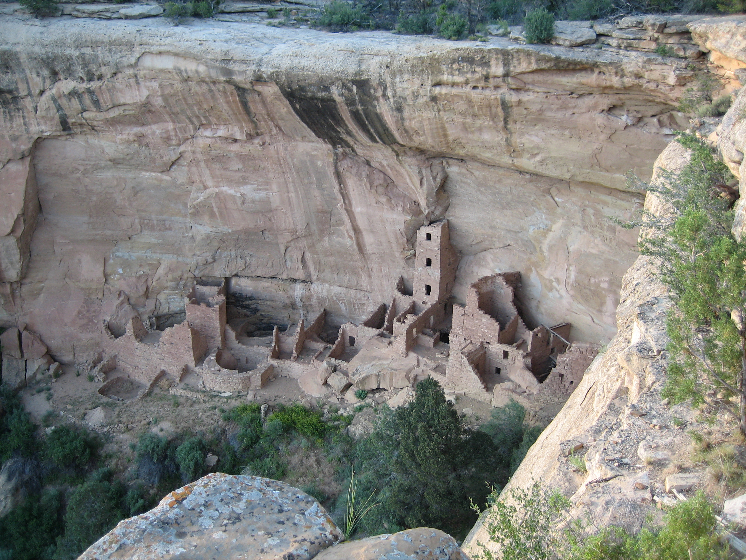 View of cliff dwelling from above a canyon