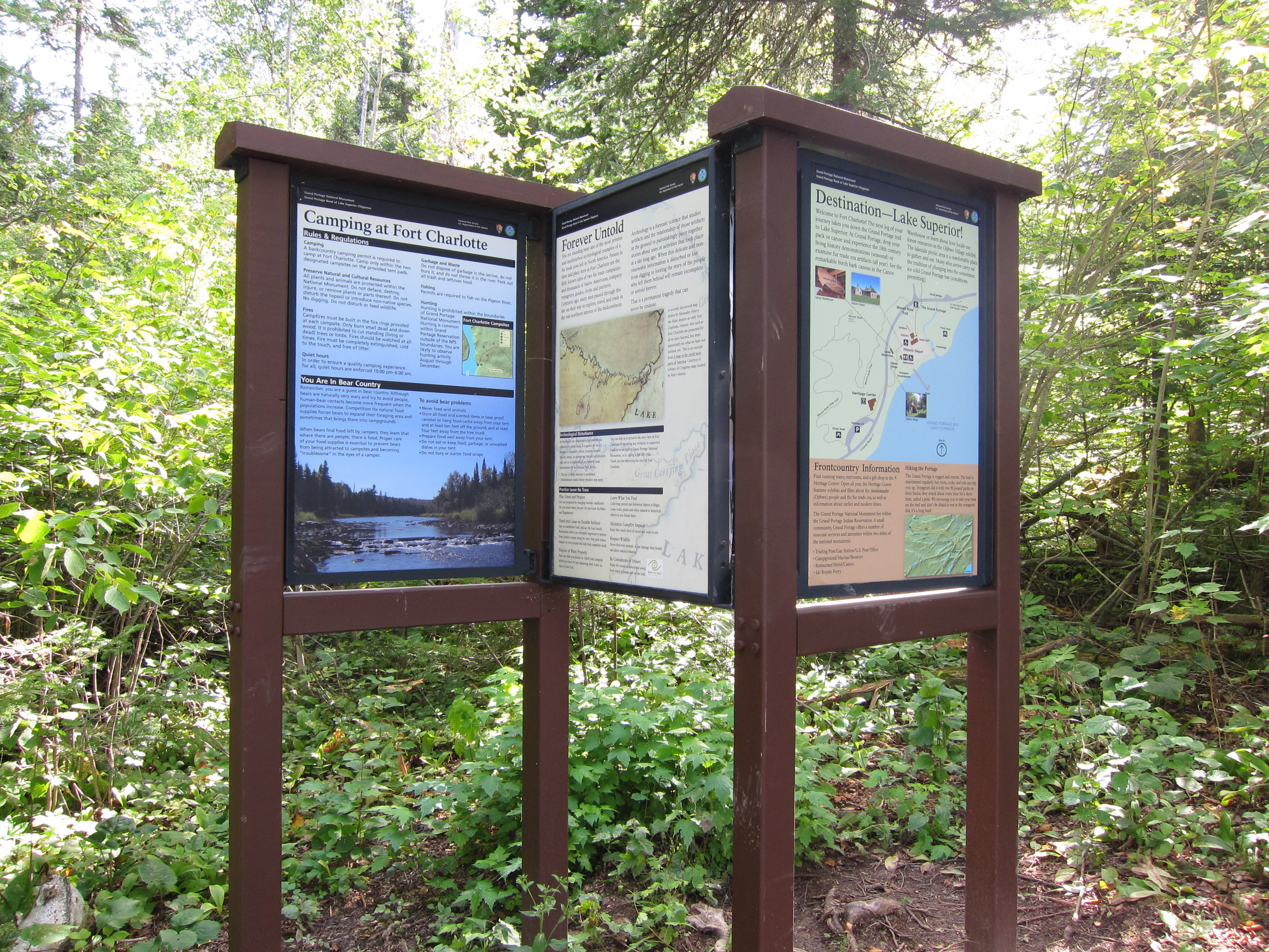 Informative panels mounted in wooden kiosk.
