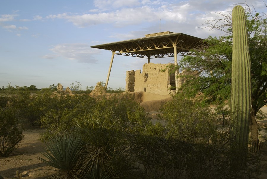 earthern Great House with its roof among desert plants
