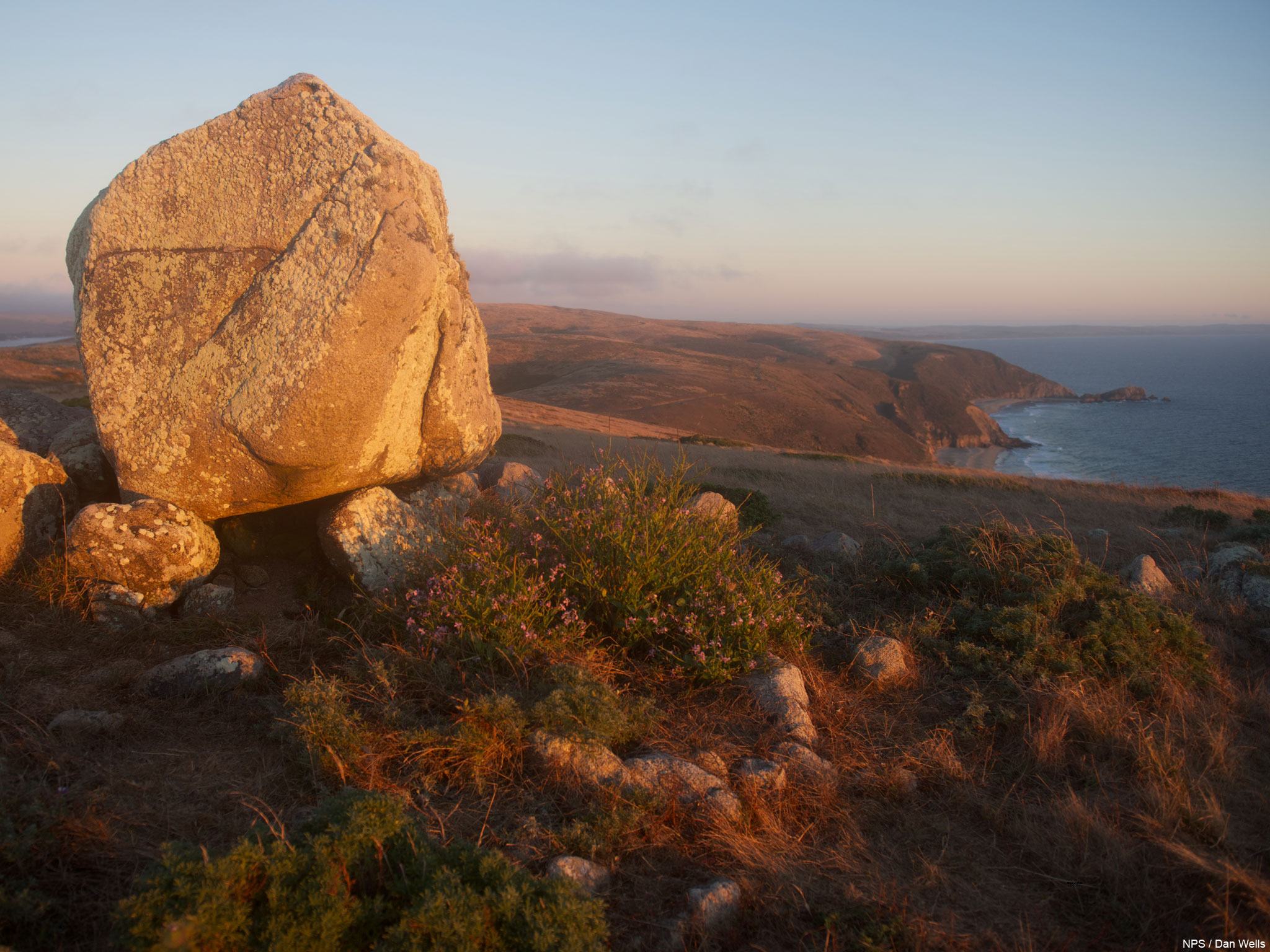 Photo taken at sunset looking south from Tomales Point with a large granite boulder on the left.