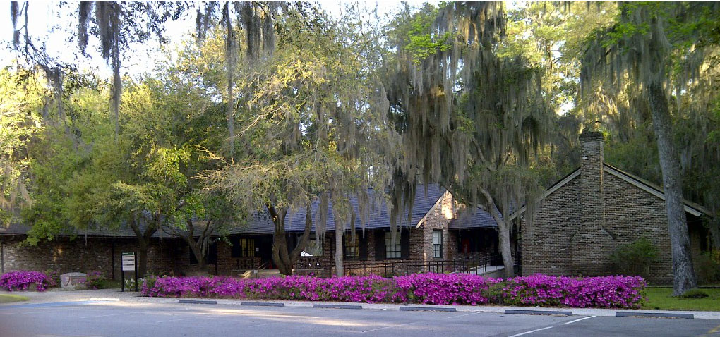 Brick building of the Visitor Center with Azaleas blossoming in front