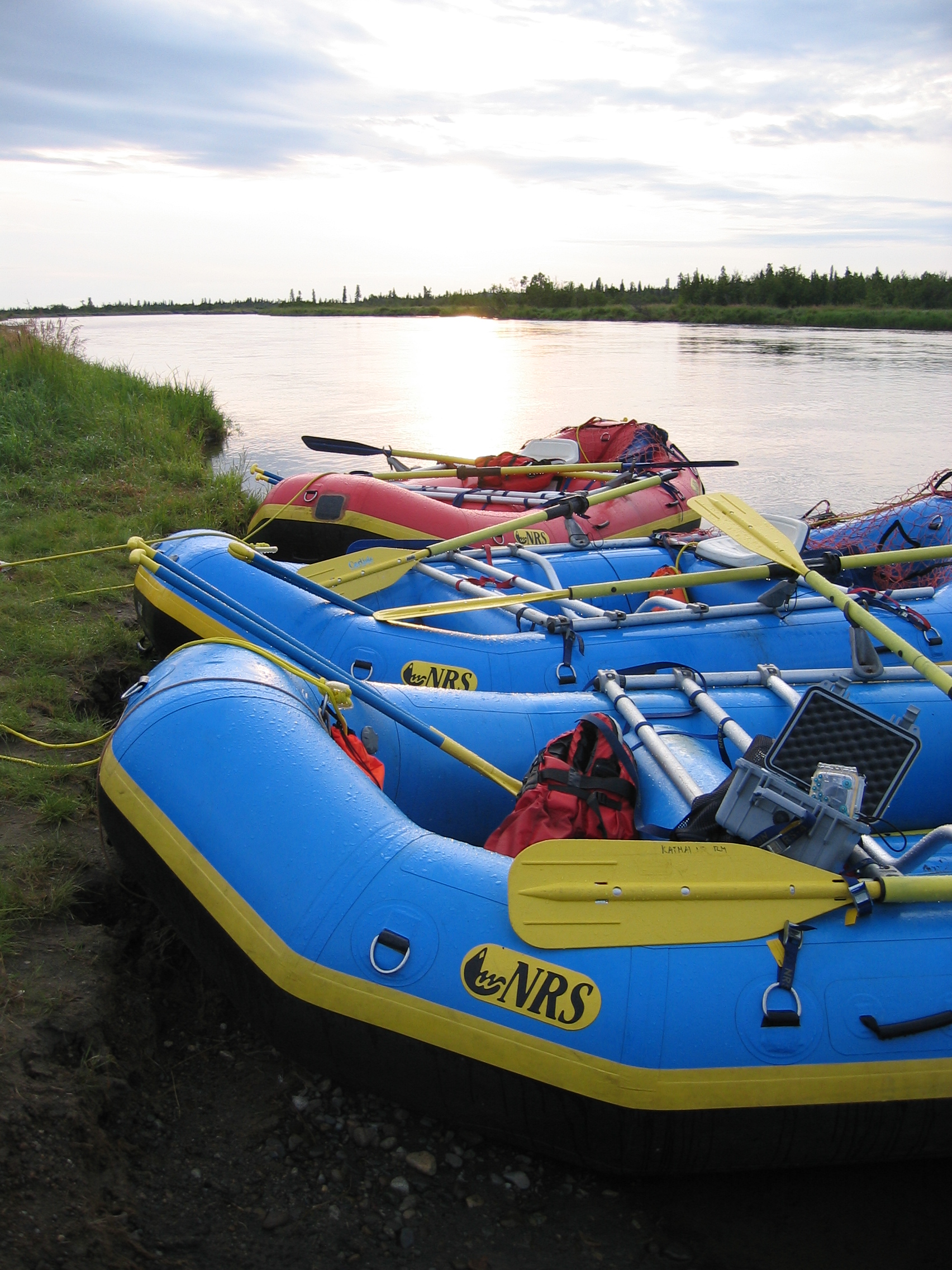 inflatable rafts on the edge of a river