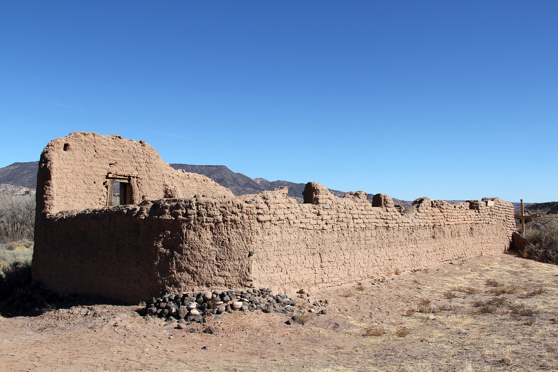 crumbling adobe structure with blue sky