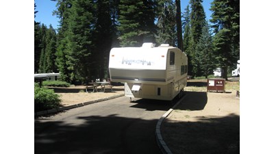 A recreational vehicle parked in a campsite