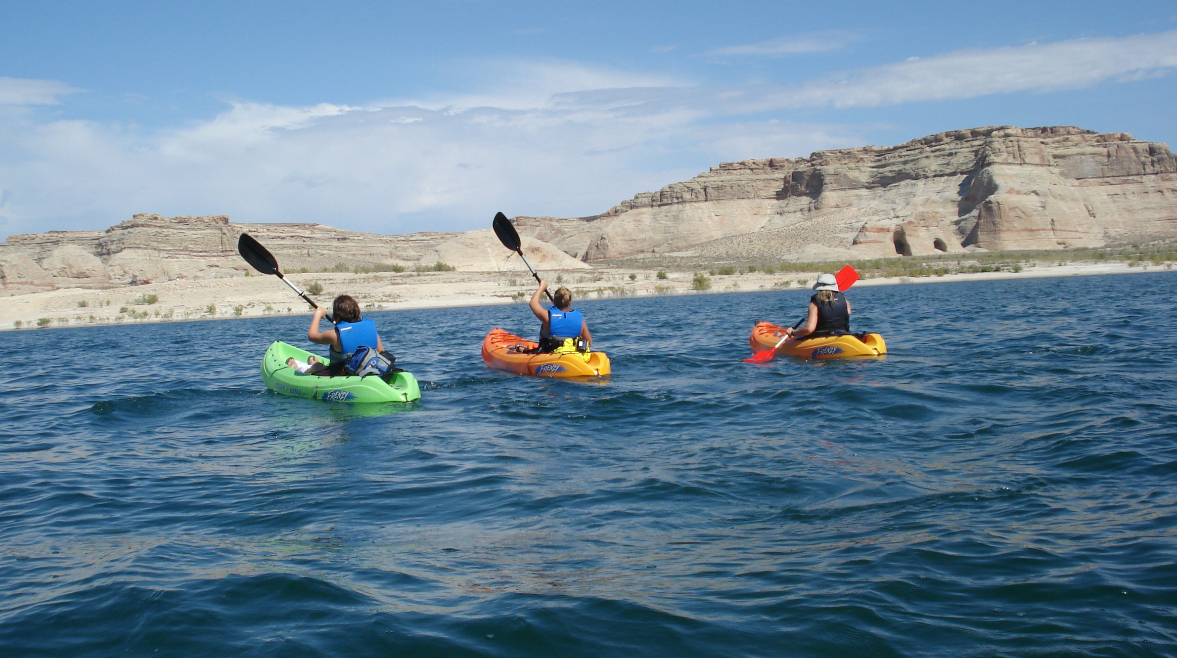 Three kayaks on the lake.