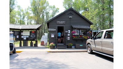Gros Ventre campground kiosk with information board and visitors checking in.