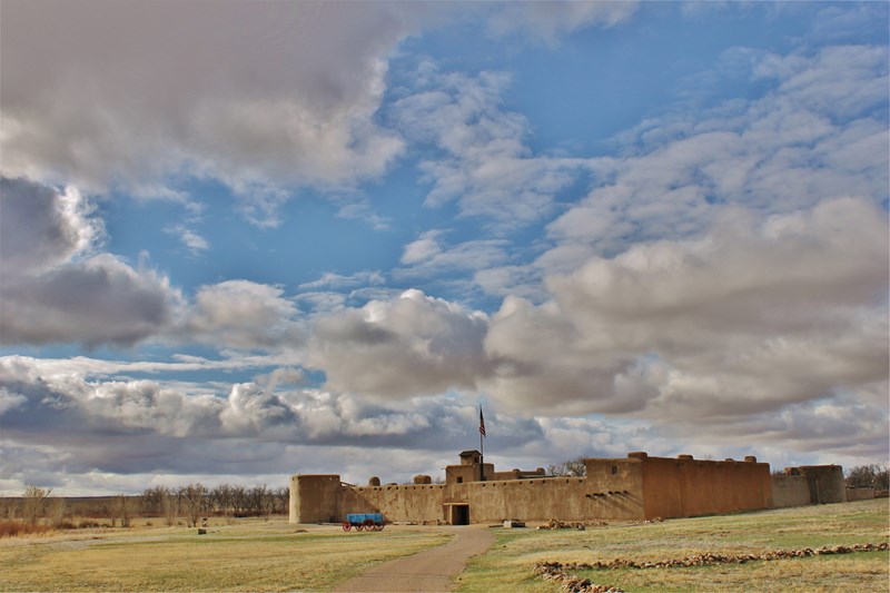 Bent's Old Fort Bent's Old Fort with shortgrass prairie in foreground and blue sky and clouds above