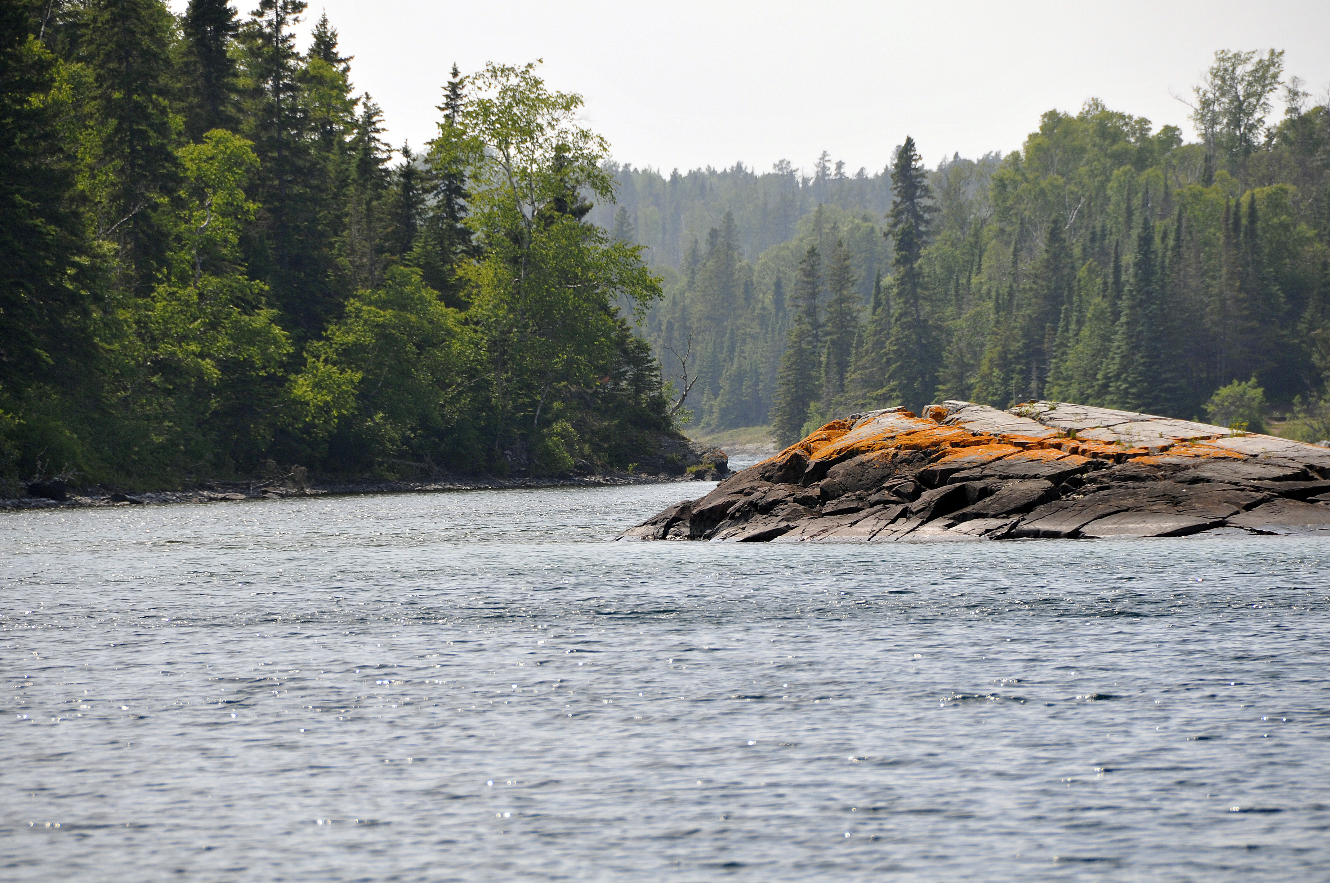 A lichen-covered rock marks the entrance to Chippewa Harbor.