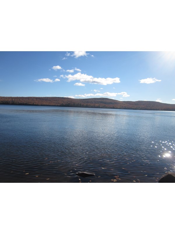 View of the blue waters of Lake Desor from the North Lake Desor Campground.