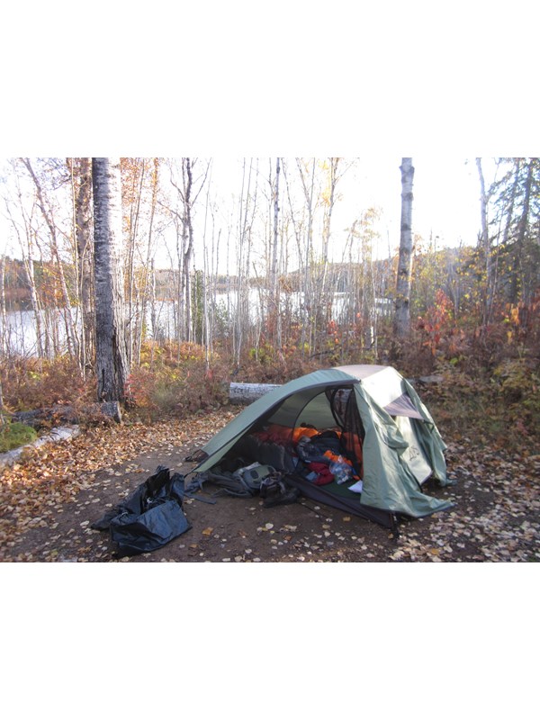 A tent at an individual tent site with a view of Hatchet Lake in the fall.