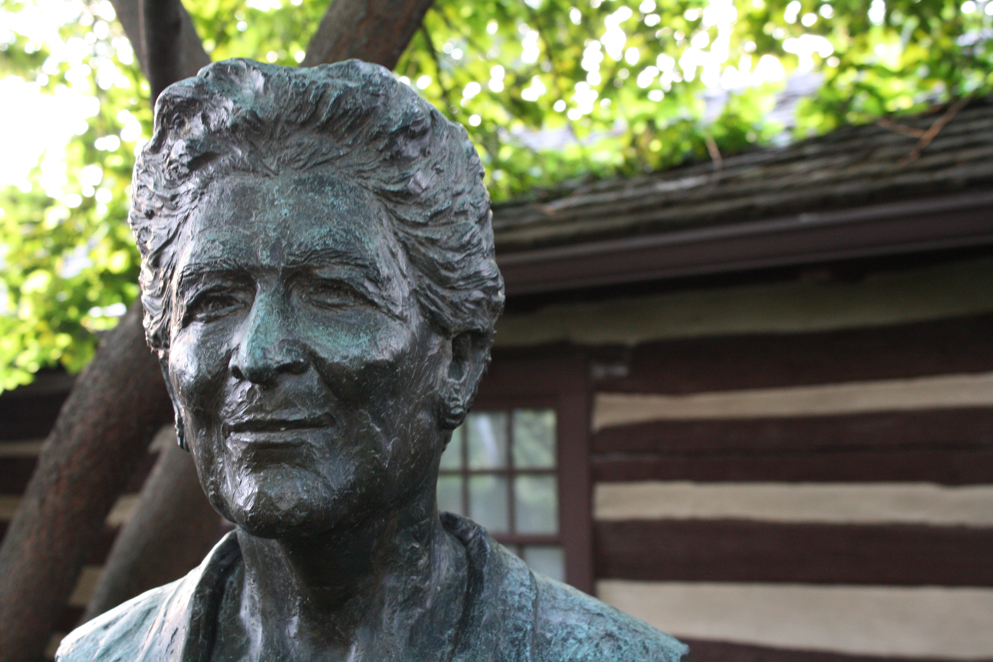 Bust of Catherine Filene Shouse with building in back