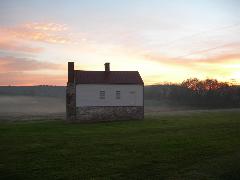 The Secondary House Sun rise and fog behind the historic Secondary House on the Best Farm.