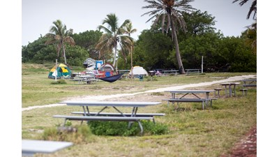 Tents are set up on the overflow area of Garden Key
