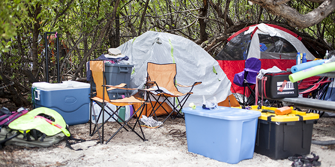 Tents and supplies set up on the campground.