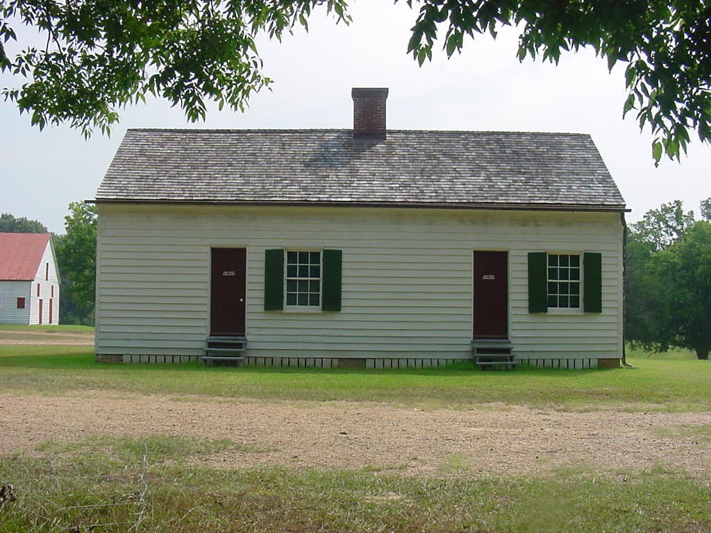 One story wood frame house with two doors and two windows